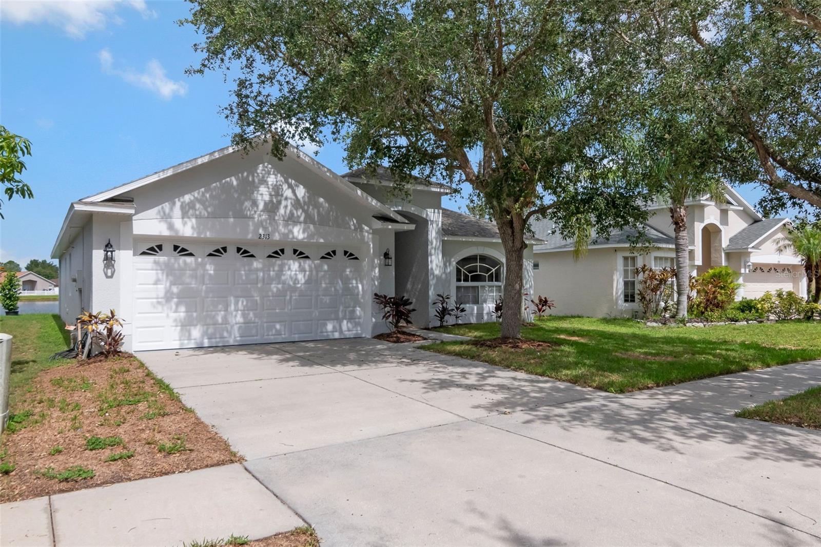 Welcome to this beautifully updated 3-bedroom, 2-bathroom turnkey home located in the highly desirable River Bend community. This move-in-ready property features a brand-new roof, stylish luxury vinyl plank flooring, fresh Frieze carpeting, and new interior and exterior paint throughout. The completely remodeled kitchen is designed to impress with granite countertops, stainless steel appliances, updated cabinetry, and modern fixtures, making it the perfect space for cooking and entertaining. Enjoy added privacy with no direct backyard neighbors while relaxing and taking in the peaceful pond views from your backyard. Residents of River Bend enjoy access to a community pool and benefit from a convenient location just minutes from Interstate 75, shopping, dining, and downtown Tampa. Don't miss the opportunity to own this beautifully renovated home that combines modern upgrades, a desirable location, and a tranquil setting. Fidelity Home Warranty included!