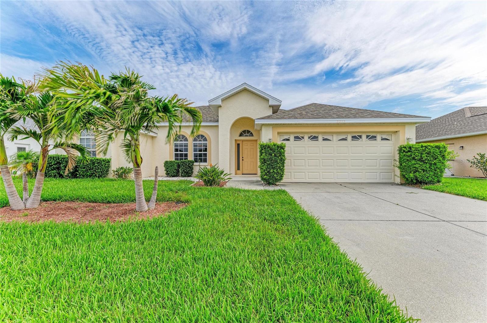 Beautiful 3 bedroom, 2 bathroom, 2 car garage home with large living areas and new roof 2025, new light and bright interior paint and new quartz countertops in kitchen. Wallingford subdivision has low HOA fees of $535 annually. Two large living areas with vaulted ceilings great for entertaining! Foyer has large closet. Living room and dining room combo has sliding glass doors to lanai. Family room and dinette area has sliding glass doors to lanai. Kitchen with gorgeous quartz countertops, white cabinets, white appliances and window above kitchen sink. Large tranquil primary bedroom with sliding glass doors to lanai. Primary bathroom has garden tub, shower, dual sinks and walk-in closet. Bedroom 2 and 3 with walk-in closets. Guest bathroom with vanity, tub shower combo, linen closet with door to lanai. Split floor plan. Carpet and ceramic flooring.  Under air laundry room with door to garage.  2 car garage has laundry tub. Large screened lanai. Tropical landscaping with sprinkler system for great curb appeal. Palm tree hedge in backyard provides the ultimate privacy. Wallingford subdivision is close to shopping, dining, I-75, UTC Mall, Costco, Sam's Club, downtown Sarasota/Bradenton, airport and a straight drive to Anna Maria Island beaches. This home is move-in ready and waiting for its next lovely owner. Come live the Florida lifestyle today!