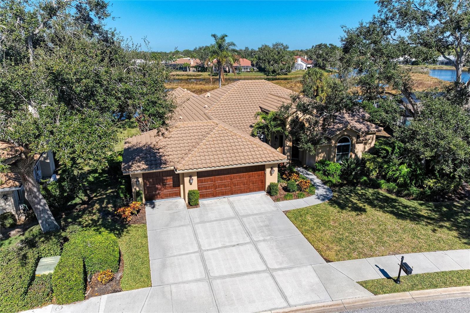 Welcome to this simply spectacular. welcoming home in the gated community of Deer Creek in Sarasota's Palmer Ranch. This quality-built four-bedroom pool home, plus a den and three full baths, sits on a peaceful lake and is designed to truly enjoy Florida living—inside and out.

Natural light pours in through multiple windows and sliders, creating a bright, open feel and easy access to the private screened pool and lanai. The spacious gourmet kitchen is the heart of the home, featuring solid stone countertops, a large island, and a breakfast bar—perfect for everyday living or entertaining. Open to the kitchen, the family room offers a cozy fireplace and a comfortable space to gather.

The home is thoughtfully laid out with separate living and dining rooms, ideal for hosting family and friends while still keeping everyday spaces relaxed and inviting. A split bedroom plan provides privacy for the owners’ suite, which includes large closets and a well-appointed en-suite bath. Some newer windows and sliders add peace of mind.

Deer Creek offers a 24-hour guard gate, scenic lakes and preserve views, low HOA fees, and no CDD. Conveniently located near Siesta Key Beach, shopping at Publix and Costco, the YMCA, golf courses, the Legacy Trail, and downtown Sarasota’s dining, shopping, and cultural events, this home combines comfort, style, and an unbeatable location.
