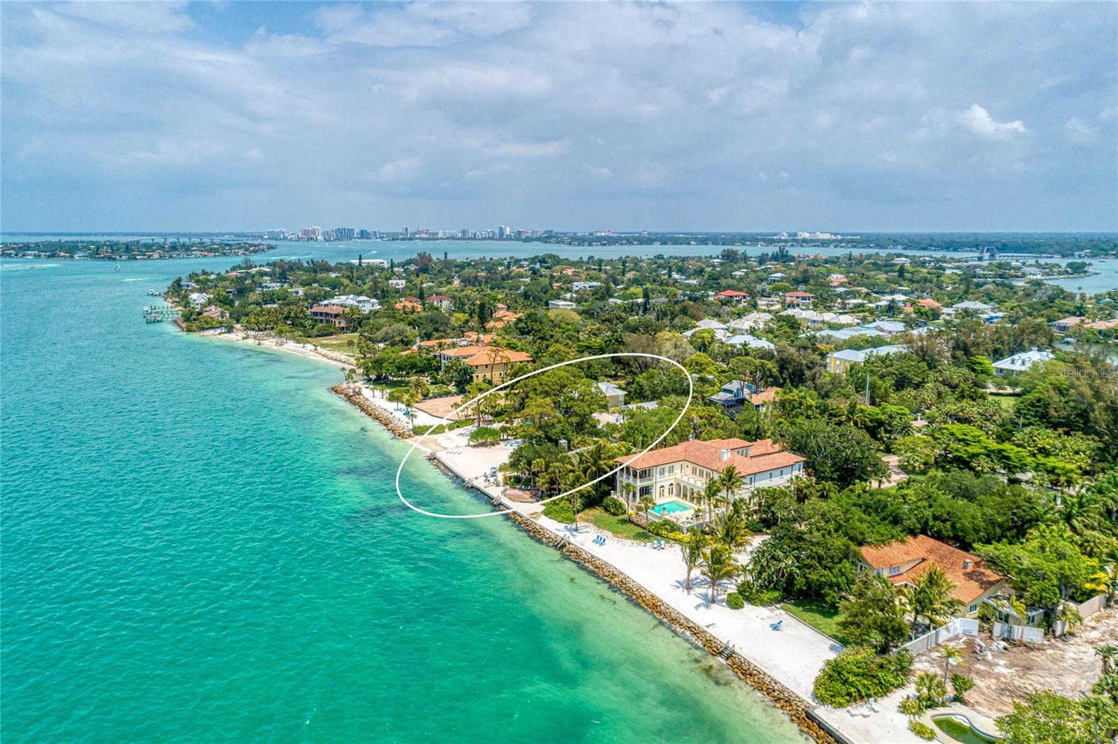 A rare opportunity to own a charming private home on almost an acre with 84 ft. of seawall located directly on Big Pass with incredible views of the Gulf of Mexico, South Lido Key Beach and Sarasota Bay. The island residence boasts mature trees and lush landscaping providing an old Florida feel nestled above the home and back patio. The walkway leads you to your own private beach and stairs that take you directly into the pristine waters.  Perfect for fishing while taking in the mesmerizing views. With 3,844 Sq. Ft., the home has an open concept living space with gorgeous fireplace perfect for entertaining while enjoying the spectacular views.  With 4 bedrooms and 4 1/2 bathrooms this spacious split plan home with two living rooms is perfect for multi-generations. Located on the prestigious North end of Siesta Key, Florida, you are minutes from the quaint village of Siesta Key where you will find restaurants, shops, grocery, and night life, and world-renowned Siesta Key Beach.  You are just a short drive from downtown Sarasota where you will find all that it has to offer including festivals, art galleries, museums, theatre, opera, ballet, diverse restaurants and bars. Directly on Big Pass, the residence affords unobstructed, panoramic views of the Gulf of Mexico. Witness the mesmerizing sunset hues painting the sky, ensuring daily moments of tranquility.  This home offers the best in waterfront living, with privacy, exclusivity, and easy access.  Welcome to your own piece of paradise on beautiful Siesta Key and the Gulf of Mexico!