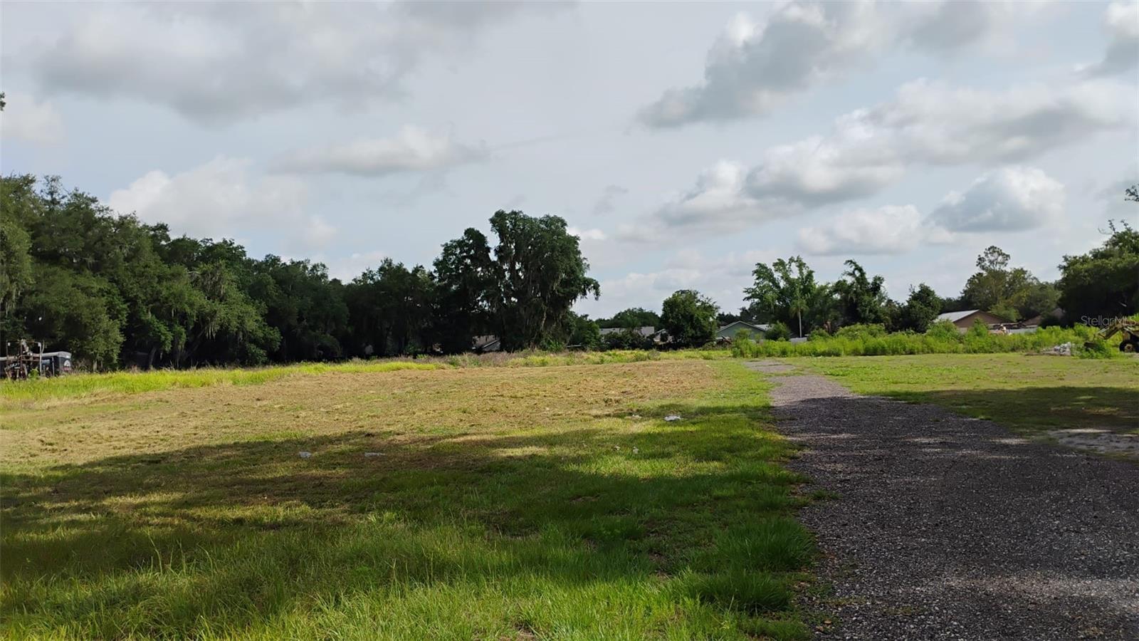 Discover the ideal setting for your dream home on this beautiful 1-acre homesite in the peaceful countryside of Plant City. This HIGH AND DRY, CLEARED parcel is ready to build and offers privacy with natural tree-lined borders, giving you both space and seclusion. Conveniently located just minutes from the I-4 ramp, you’ll enjoy easy access to Tampa and Orlando, while remaining close to downtown Plant City, shopping, dining, highly rated schools, and the new hospital. 2 miles from brand new BayCare system. With no HOA and no deed restrictions, you have the flexibility and freedom to build the home and lifestyle you’ve always envisioned.  All measurements and details are approximate and should be independently verified if important. Listing agent has an ownership interest in the property.