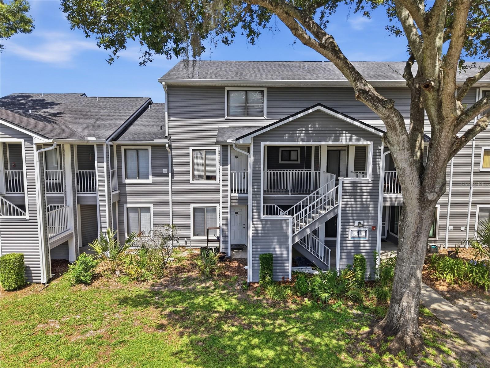 Spacious 2-bedroom, 2.5-bathroom, unique two-story condo with a functional floor plan and laminate flooring throughout—no carpet! The first floor features an inviting entry foyer, separate living and dining rooms, and a well-appointed, eat-in kitchen with black appliances, including a refrigerator, range, range hood, and dishwasher. The living room boasts soaring vaulted ceilings and a cozy wood-burning fireplace.
Upstairs, you'll find two generously sized bedrooms, each with access to its own updated full bathroom. The guest bathroom features a tiled tub/shower combination with a rain shower head, while the primary bathroom offers a beautifully tiled walk-in shower with a glass enclosure and rain shower head. One bedroom includes a spacious walk-in closet. A convenient half bath is located on the first floor for guests.
Residents enjoy access to community amenities, including a swimming pool with a relaxing hot tub and two tennis courts. Ideally located just minutes from Valencia College, UCF, Full Sail University, Highway 417, shopping, dining, and everyday conveniences, this home offers easy access to everything you need. Whether you're looking for a primary residence or an investment opportunity, this move-in-ready condo is a must-see!