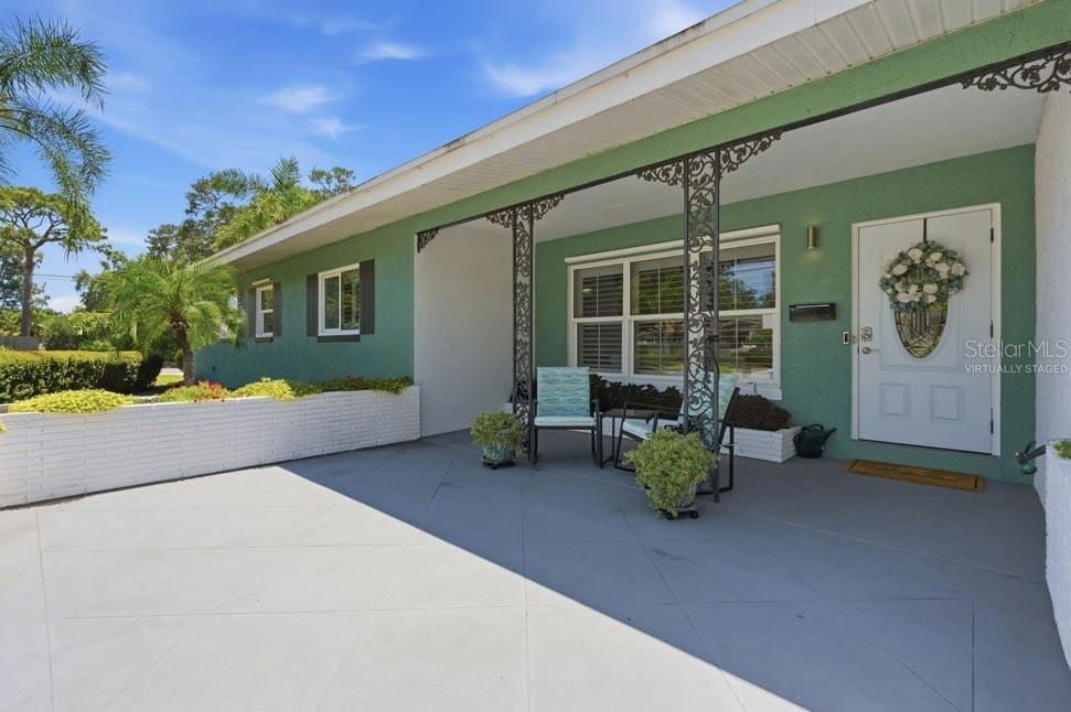 One or more photo(s) has been virtually staged. Welcome to this beautifully maintained pool home in the highly desirable Jungle Terrace area, situated on an oversized corner double lot just steps from the water and private waterfront park access. Offering a rare combination of space, flexibility, and outdoor living, this property is designed to fit a variety of lifestyles.

Inside, you'll find multiple spacious bedroom suites with large walk-in closets, updated bathrooms, and an open-concept living and dining area enhanced by attractive vinyl ceilings and abundant natural light. The kitchen features granite countertops, stainless steel appliances, stylish cabinetry, a tile backsplash, and a convenient breakfast bar perfect for casual dining and entertaining.

A versatile Florida room with a full bath and walk-in closet provides additional living space ideal for guests, a home office, hobby room, or potential in-law suite. Crown molding, textured accent walls, and thoughtful upgrades throughout add character and charm.

Step outside to your private backyard retreat featuring a large screened pool enclosure, an oversized pool with electric pool heater, extensive landscaping, fruit trees, and a beautifully designed courtyard and patio area. The fully fenced yard offers privacy while still providing plenty of room for entertaining, pets, or storing a boat or recreational vehicles.

Additional highlights include a 2020 roof, 2020 HVAC system, 2020 electrical panel, brand-new 2026 water heater, plantation shutters, hurricane shutters, public water and sewer, solar panels that will be paid off at closing (making the avg. electric bill under $40!), and a generator that conveys with the sale.

As an added bonus, owners enjoy deeded access to a private waterfront park with a small beach at the end of 29th Avenue. Conveniently located near beaches, parks, shopping, dining, and downtown St. Petersburg, this exceptional property delivers the Florida lifestyle you've been looking for.