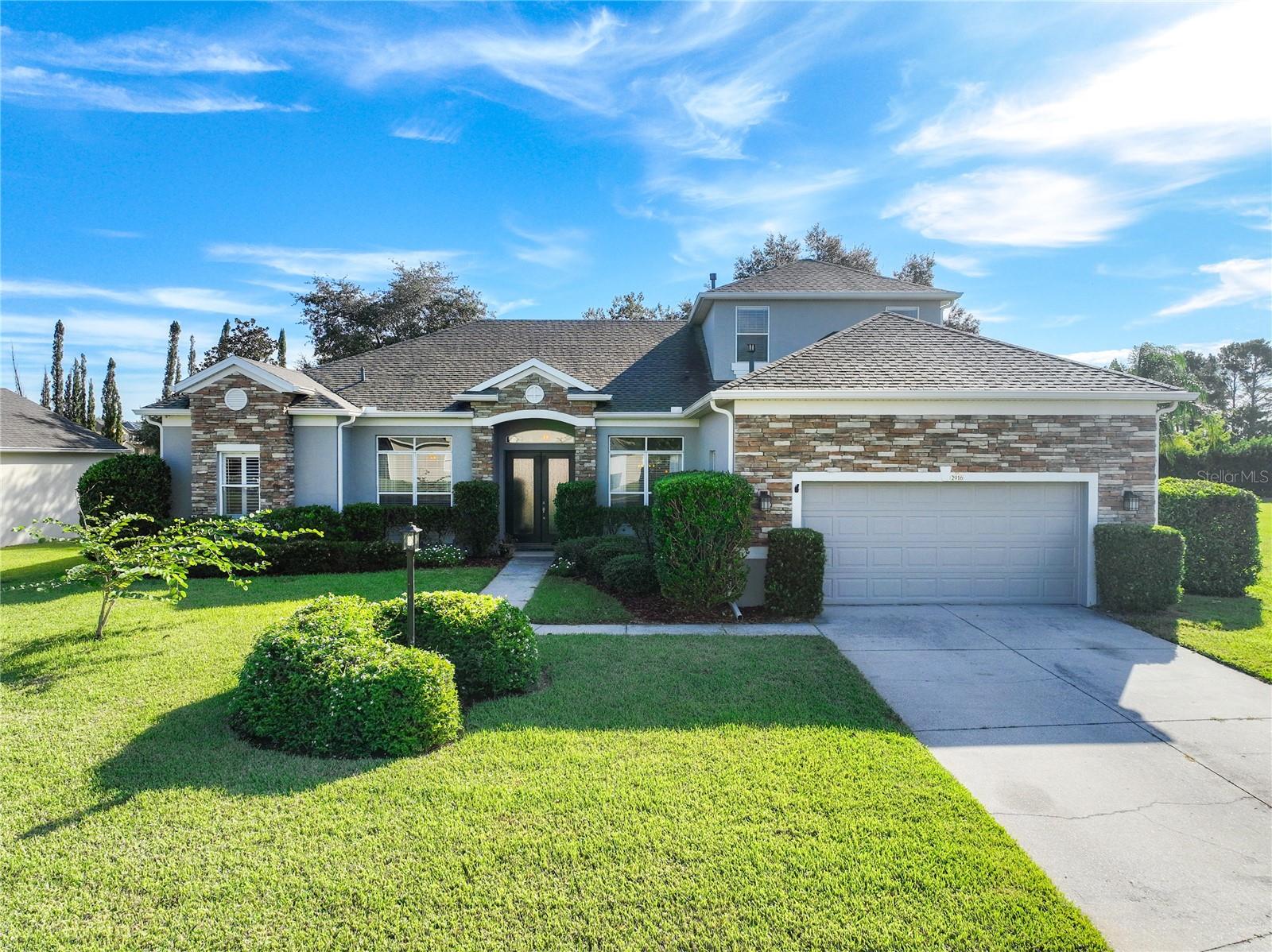 Welcome to this beautiful 4BR/3BA home w/BONUS ROOM in the GATED community of Regency Hills. You will love the curb appeal of this home with its stone entrance & mature landscaping. Entering the home, you will notice the beautiful slate tile & hand-scraped wood flooring throughout the main living area. The formal living & dining rooms are near the front of the home. Continuing through the home, you will enter the family room that features beautiful wood flooring. The kitchen features New Quartz counters, pendant lighting, and a tiled backsplash. It opens to the family room and breakfast nook with built-in bench seating. Enjoy cooking with natural gas & all kitchen appliances that come with it. Sliding doors at the back of the family room lead to a covered Lanai, & decorative windows above the doors allow plenty of natural light into the living area. The backyard is fenced, with lots of room for a private pool. A large second-floor bonus room can be used for a theater, playroom, or whatever your heart desires. All bedrooms are nicely sized and are located downstairs. The Master Suite features walk-in closets with organizers, dual vanities, a garden tub & separate shower. If you are looking for a community with all of the amenities you could dream of, then you will love Regency Hills. It is gated and features a community pool, basketball courts, tennis courts, & a playground. With this home's fabulous features, community amenities, and great location, it is sure to be at the top of your list. Be sure to see this house today before it's gone!
