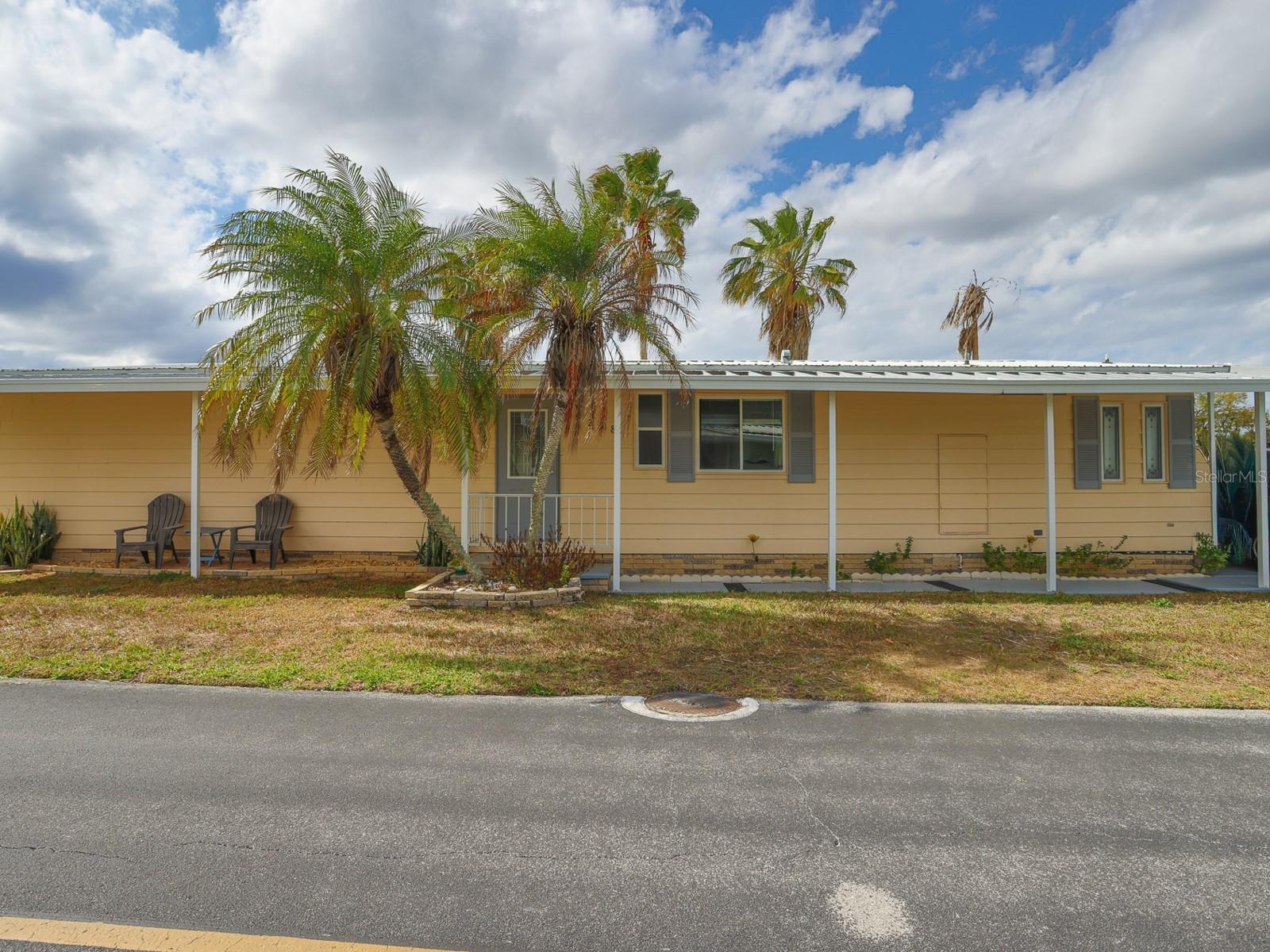 New Price!  Welcome to waterfront living! Enjoy beautiful lake views from this MOVE-IN READY 2-bedroom, 2-bathroom manufactured home located in the desirable 55+ Floral Lakes Community in Bartow. All windows have push up and push down blinds plus weather resistant drapes, helping keep the electric bill down. 

Inside, you’ll find wood laminate flooring throughout, a wet bar complete with a small refrigerator, and a utility room featuring an additional outdoor refrigerator—perfect for staying refreshed on those hot days. Creating a clean and low-maintenance living space. Relax and take in the peaceful water views from the enclosed porch, or step out onto the adjoining open porch, both perfectly positioned to overlook the lake. A private dock extends out to the water, ideal for enjoying nature, relaxing, or fishing.

Additional exterior features include a one-car carport and an outdoor storage/workshop area for tools and hobbies.

Residents of Floral Lakes enjoy a variety of amenities including access to a stocked pond with a community boat ramp and dock, plus a clubhouse featuring recreation space, shuffleboard, putting green, and a large heated swimming pool. The active community offers social clubs, dances, exercise classes, potlucks, and optional RV storage.

Conveniently located in Central Florida between Tampa and Orlando, this golf-cart friendly community is close to the Bartow Civic Center, Bartow Public Library, and Mary Holland Park.

Association approval required. HOA fee is $105 monthly.