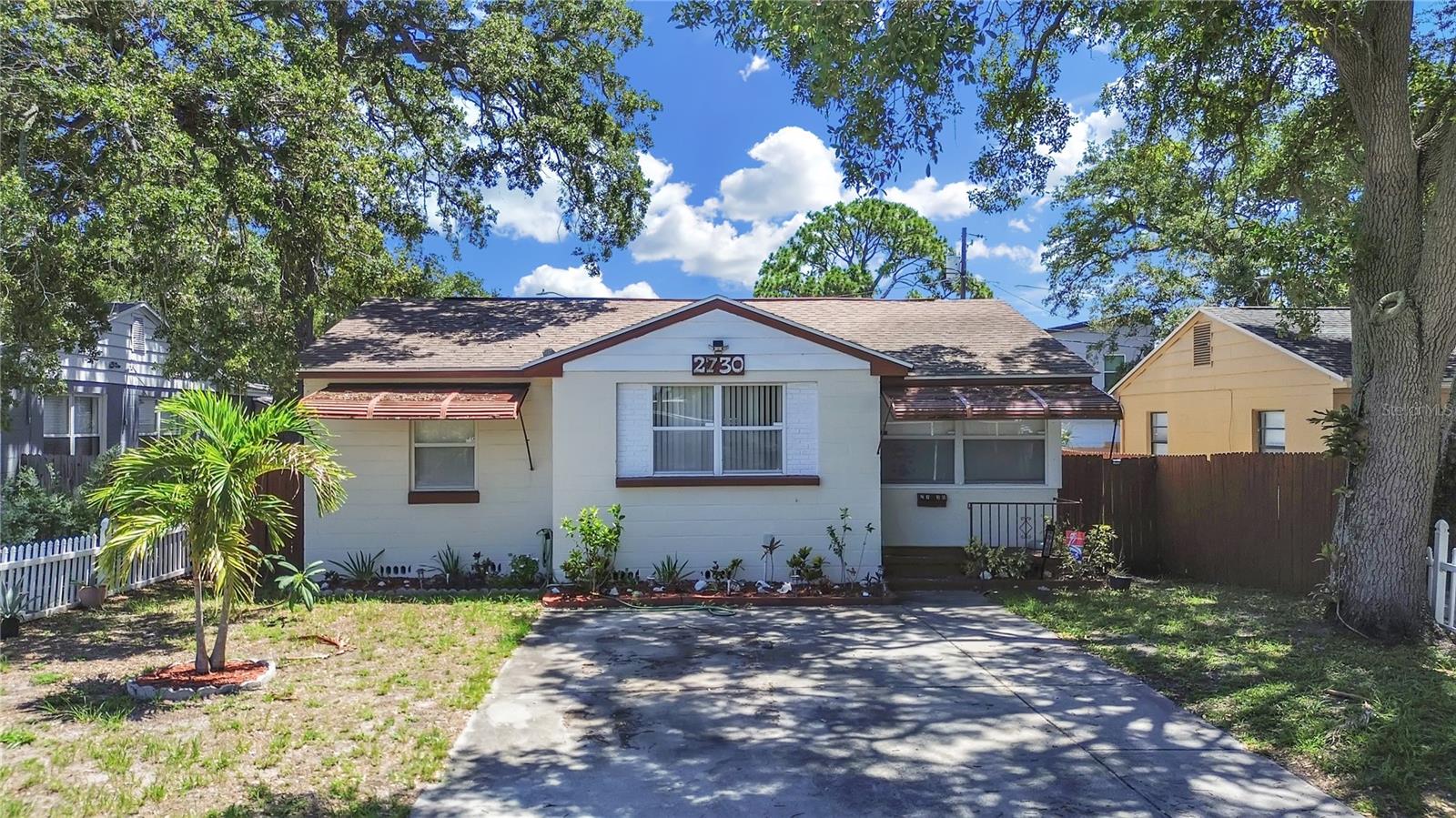 Enjoy easy St. Pete living in this solid concrete block home with major improvements on the way. The seller will install a new roof and new A/C system prior to closing, giving the next owner added peace of mind from day one. Inside, the home offers a comfortable layout with vinyl/tile flooring in the main living areas, carpeted bedrooms, an updated kitchen and bath, and a flexible bonus space currently used as a playroom that could also serve as an office, den, reading room, or extra living area. Step outside to a fenced backyard with room to relax, garden, entertain, or let pets play. Alley access leads to the garage and provides convenient off-street parking. Located in verified Flood Zone X and just minutes from Downtown St. Pete, local restaurants, parks, shopping, major roads, and the Gulf beaches. Tenant occupied month-to-month and can be delivered vacant prior to closing if buyer desires.