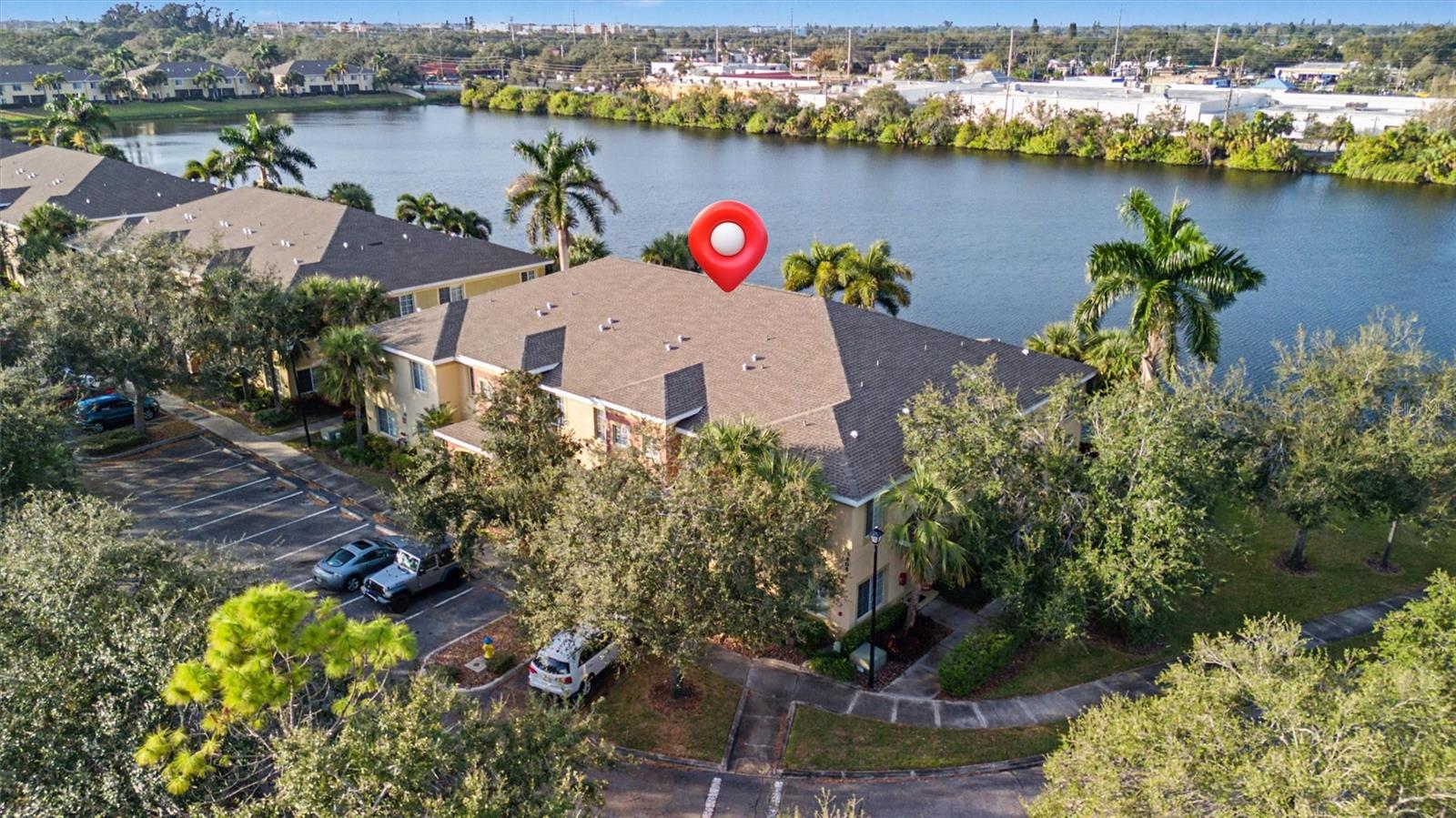 Welcome to Lakeside Village, a cheerful and gated townhome community where natural surroundings and everyday convenience come together. This well-designed 2-bedroom, 2.5-bath townhome offers a flexible layout and peaceful lake views in one of Bradenton’s most central locations.

The first floor features an open dining and living area, a functional kitchen with ample storage, and a convenient half bath, ideal for guests and entertaining. Step outside to the screened porch overlooking the lake, a perfect spot to enjoy morning coffee, evening breezes, and the wildlife that frequents the community.

Upstairs, the primary bedroom includes an en-suite full bathroom, providing privacy and comfort. A second full bathroom serves the guest bedroom and the versatile loft space, ideal for a home office, reading nook, fitness area, or playroom. The upstairs laundry adds everyday convenience.

Lakeside Village offers a pet-friendly (small) atmosphere with mature landscaping, walking areas, a community pool, and lakefront deck. The association fee includes water, sewer, trash, and more, adding value and simplicity for owners.

Located just 6 miles to Anna Maria Island, 1.4 miles to IMG Academy, 7 miles to SRQ Airport, convenient to Blake Medical Center, and minutes from shopping, dining, and grocery options—this community places the best of Bradenton and the gulf coast within easy reach.
NEW kitchen appliances, 2016 HVAC