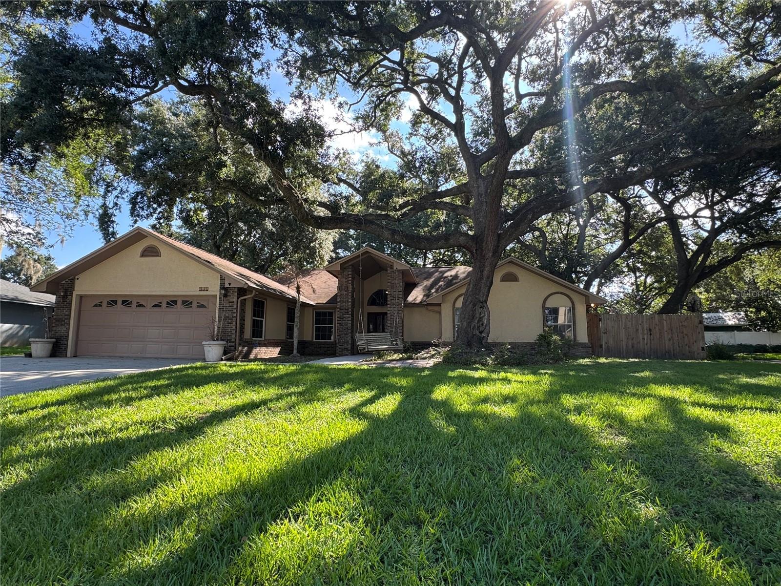 Welcome to this beautifully maintained 3-bedroom, 2-bath home located in the highly desirable Kirkland Lake Estates community of Auburndale. Nestled among majestic oak trees and just moments from Lake Ariana and downtown Auburndale, this property offers the perfect blend of comfort, convenience, and Florida charm—with NO HOA restrictions.

Situated near the end of a quiet cul-de-sac, this meticulously maintained home showcases true pride of ownership and features numerous valuable updates, including a complete re-plumb, a 5-year-old roof, and a newer energy-efficient HVAC system designed to keep utility costs low year-round. For added peace of mind, the property has received annual termite inspections and preventative maintenance.

Inside, you'll find a spacious living area highlighted by a stunning custom-built entertainment center that serves as the focal point of the home. The thoughtful floor plan offers comfortable living spaces ideal for both everyday living and entertaining.

Step outside and enjoy the best of Florida living from the large, screened room, perfect for relaxing with your morning coffee or hosting family and friends. The beautifully landscaped yard features a full irrigation system, mature oak trees providing shade and character, and a newer storage shed for all your tools and outdoor equipment. The home is also equipped with a security system for added safety and convenience.

Whether you're relaxing at home, enjoying nearby Lake Ariana, or taking advantage of the shopping, dining, and community events in downtown Auburndale, this property offers an exceptional lifestyle in one of the area's most sought-after neighborhoods. Schedule your private showing today!