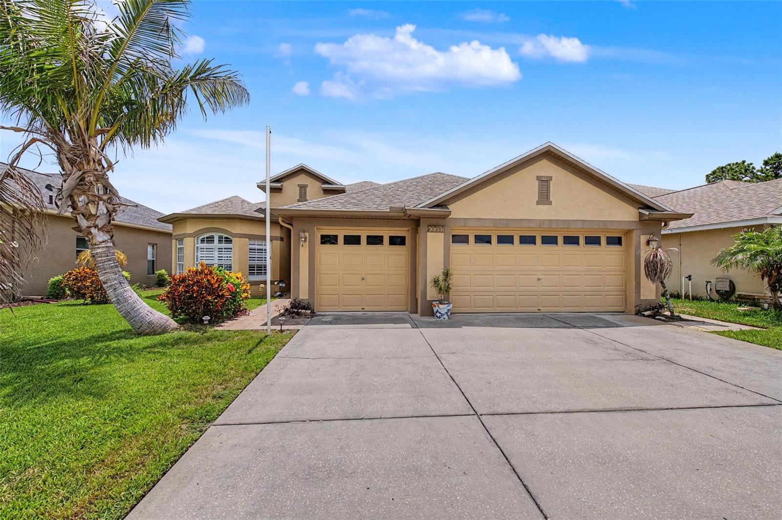 Virtually Staged. WOW! Take a look at this 4 BEDROOM, 2 BATHROOM, 3 CAR GARAGE POOL HOME LOADED WITH UPDATES AND UPGRADES IN THE STUNNING KEY VISTA COMMUNITY ON A QUIET CUL DE SAC. The open kitchen has been remodeled. THE CABINETS AND COUNTER TOPS HAVE BEEN REPLACED, NEW REFRIGERATOR, AND A NEW DISHWASHER. The QUARTZ KITCHEN ISLAND IS EXCELLENT FOR ENTERTAINING AND USING AS A CASUAL SPACE FOR BAR STOOLS. The big open family says bring your sectional and huge TV because there is plenty of room! THE SLIDERS TO THE POOL HAVE RECENTLY BEEN REPLACED AS WELL AS NEW WINDOWS IN THE BACK OF THE HOUSE. It sure feels like Florida here with the PLANTATION SHUTTERS and light bright colors and SPARKLING SWIMMING POOL. There are no rear neighbors, you can enjoy your pool and outdoor space in private. New interior paint in many of the rooms. THE PRIMARY BEDROOM HAS MORE THAN ENOUGH ROOM FOR A KING SIZE BED AND THE PRIMARY BATHROOM FEATURES A STAND UP SHOWER AND SOAKING TUB. There is enough room to stretch out with double sinks too! Some other noteworthy things about this very special home are HIGH CEILINGS, a NEW ROOF IN 2023, NEW AC IS 2017 AND A NEW HOT WATER HEATER. You don't have to go far to enjoy the community amenities! There is a huge heated pool, clubhouse, playground, tennis and pickleball courts, fitness center, and more. Key Vista Nature Park is about a mile away,  Sunset Beach and Fred Howard Park in Tarpon Springs are just a short drive away!