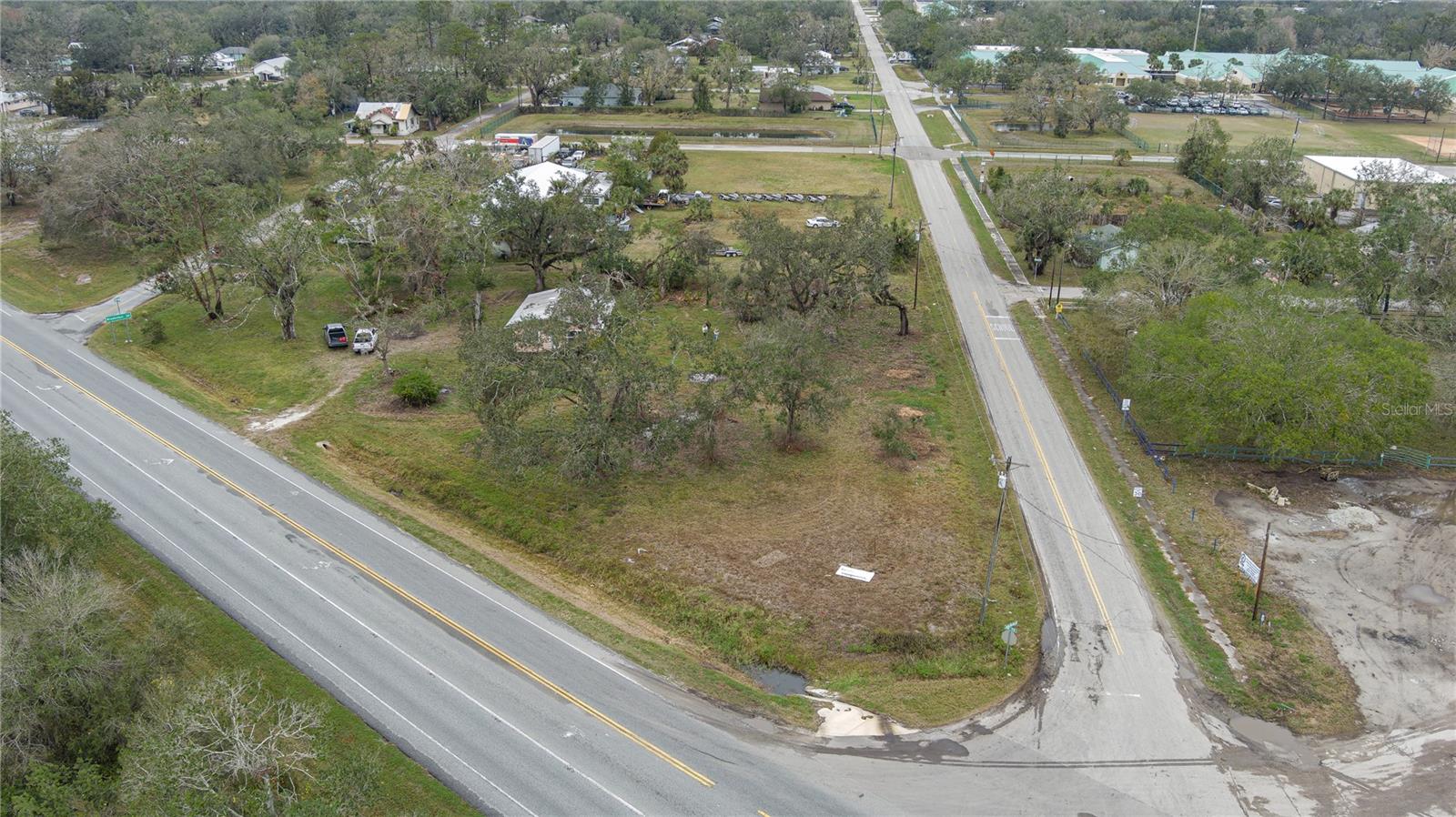 Discover an incredible opportunity to own almost 1.5 acres of prime real estate at the highly visible corner of State Road 70 and Singletary Road in Myakka City, Florida. This property is perfectly positioned in an area experiencing exciting growth, with a mix of residential and commercial development reshaping the community.

The property is already zoned Village, allowing for a variety of permitted and special uses under Manatee County regulations, making it ideal for investors or business owners looking to capitalize on this strategic location. Whether you're considering retail, office space, or other ventures, this corner lot provides the flexibility to bring your vision to life.

Adding to its appeal, Singletary Road is quickly becoming a hotspot for high-end development. Several state-of-the-art golf courses are being constructed just down the road, drawing attention and increasing traffic to the area. Nearby amenities include a newly opened Dollar General and gas stations, providing added convenience and ensuring that this lot is surrounded by bustling activity.

Offered at $675,000, this property represents an exceptional value in one of the most promising up-and-coming areas of Myakka City. Don’t miss the chance to secure your piece of this rapidly developing community.

For more information or to schedule a viewing today!
