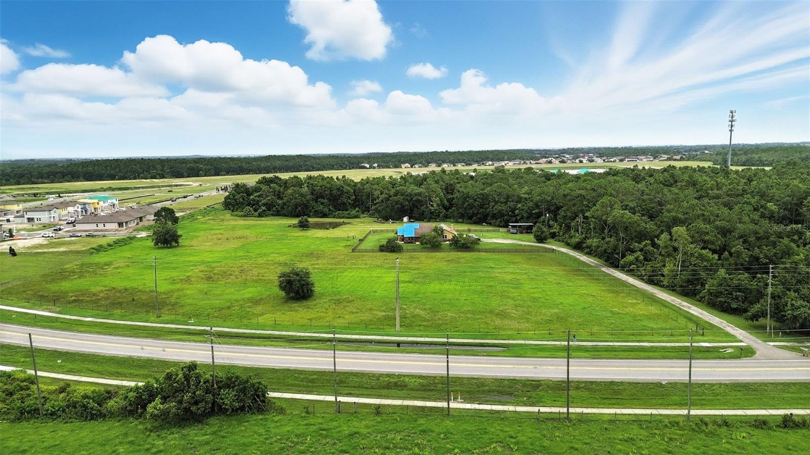 Under contract-accepting backup offers. Great opportunity to own and develop 15 acres adjacent to the Hawks Run community being built by Starlight Homes/Ashton Woods. This property is within the Urban Growth Boundary of Osceola County and an ideal parcel for a developer specializing in mixed-use development. Due to the future land use designated as Community Center Perimeter (CCP), as many as 18 residential dwelling units may be constructed per acre.