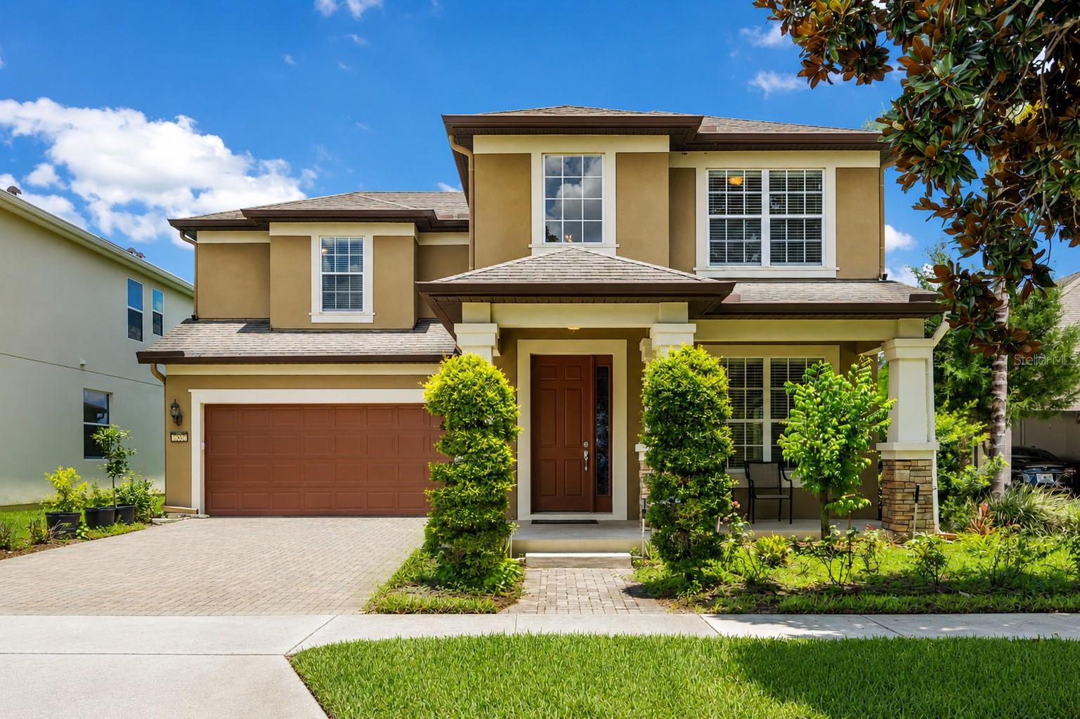 Welcome to this beautiful 4-bedroom, 3.5-bath waterfront home in one of Windermere's most desirable communities. Enjoy peaceful water views, no rear neighbors, and Disney fireworks from your own backyard, offering a rare combination of privacy, comfort, and convenience.

The open-concept floor plan is designed for both everyday living and entertaining. Large sliding glass doors fill the home with natural light and open to a screened covered lanai overlooking the water, creating the perfect space for indoor-outdoor living and year-round Florida enjoyment.

The main floor features multiple living and dining areas, including a formal dining room, a spacious great room, and a convenient powder bath. At the heart of the home, the kitchen features a large center island with breakfast bar, granite countertops, wood cabinetry, stainless steel appliances, and an upgraded high-performance range hood. Beautiful flooring flows throughout the home with no carpet, offering a clean, modern look and easy maintenance.

Upstairs, all four bedrooms are thoughtfully arranged for privacy and functionality. The spacious primary suite features a custom walk-in closet, dual vanities, a soaking tub, and a separate walk-in shower. One secondary bedroom includes its own en-suite bathroom, making it ideal for guests, multi-generational living, or a private home office.

Residents enjoy resort-style amenities including a community pool, covered playground, walking trails, a golf putting green, basketball, tennis, and pickleball courts. Ideally located just minutes from Horizon West shopping, dining, parks, major roadways, and Walt Disney World, this home is also zoned for highly rated schools, including Windermere High School.