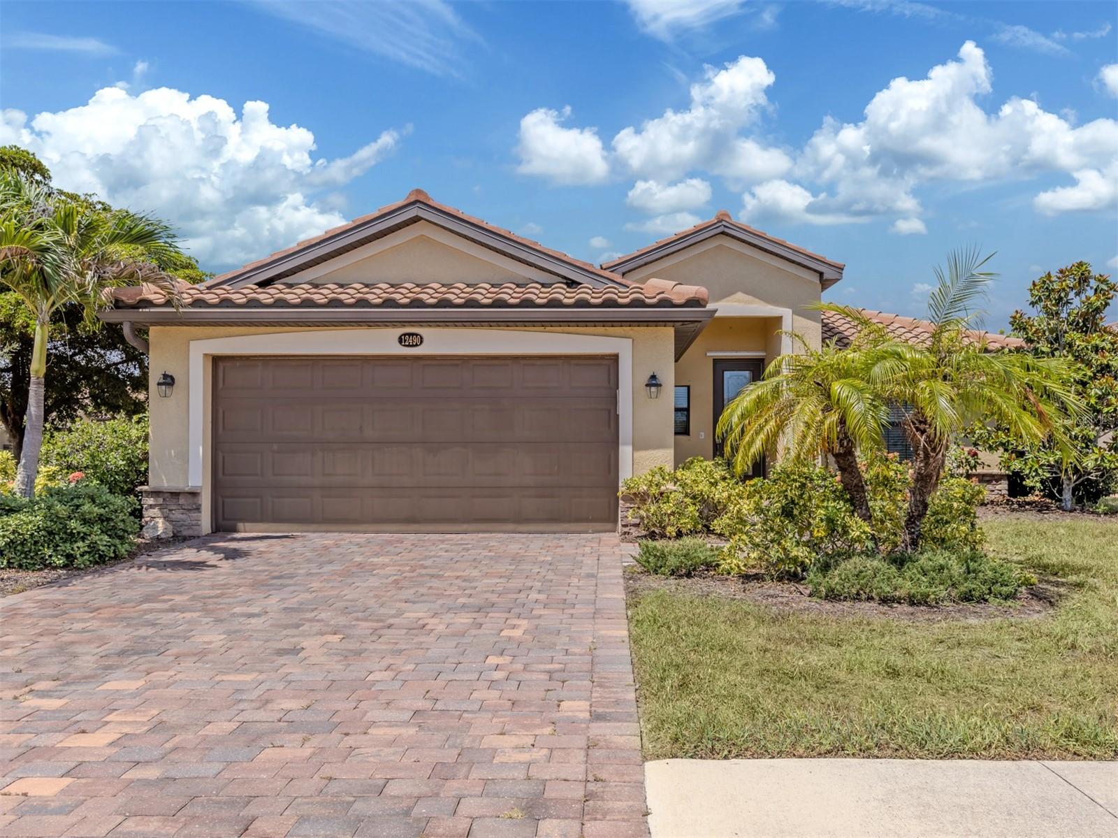 Experience the ultimate Florida lifestyle at 12490 Cinqueterre Drive, situated in the premier gated community of Gran Paradiso. This 3-bedroom, 2-bathroom, single-family residence features a bright and inviting open floor plan designed for effortless daily living and entertaining. Natural light bathes the main living areas, which flow seamlessly from the kitchen and family room combination out to the screened-in rear patio. The kitchen serves as a central hub, complete with solid surface counters and a convenient breakfast eating space. The primary suite offers a private retreat with an attached bath and a generous walk-in closet. Outside, the property includes a two-car garage and an irrigation system to keep the landscaping pristine year-round. Residents of Gran Paradiso enjoy luxury, resort-style amenities including a beach-entry pool, tennis courts, a fitness center, and walking trails. All of this is located just minutes away from Wellen Park, local shopping, and beautiful Gulf Coast beaches. Schedule your private tour today.