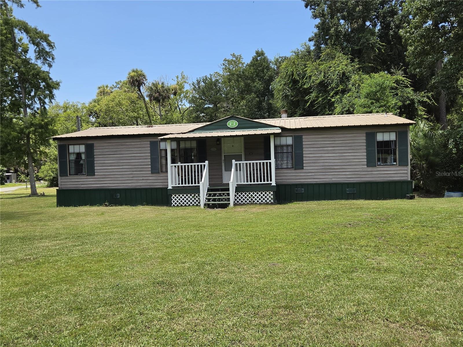 Here is a perfect opportunity to experience Florida's nature at its finest. It is a great place to land if you are from outside the area and want to get a feel for Florida living! The lovingly decorated and FULLY FURNISHED 3-bedroom, 2 bath home has all you could want to live comfortably.  There is a separate living and family room, a kitchen eating area, a dining area, an inside laundry room complete with washer & dryer and a screened porch. You may feel like you are in the middle of nowhere, yet you are pretty much centrally located to many nearby cities. Deland is 22 miles away, Daytona Beach is 35 miles away and Ormond Beach is 32 miles away.  For less than $80.00 a year, you can become a member of the neighboring Astor Forest Property Owners Assn. which will allow you access to a private boat ramp less than a half mile away. The ramp accesses a canal that leads (a short distance) to the St. Johns River, or you can take advantage of the free public boat ramp in town. Call for all the details. Available now!