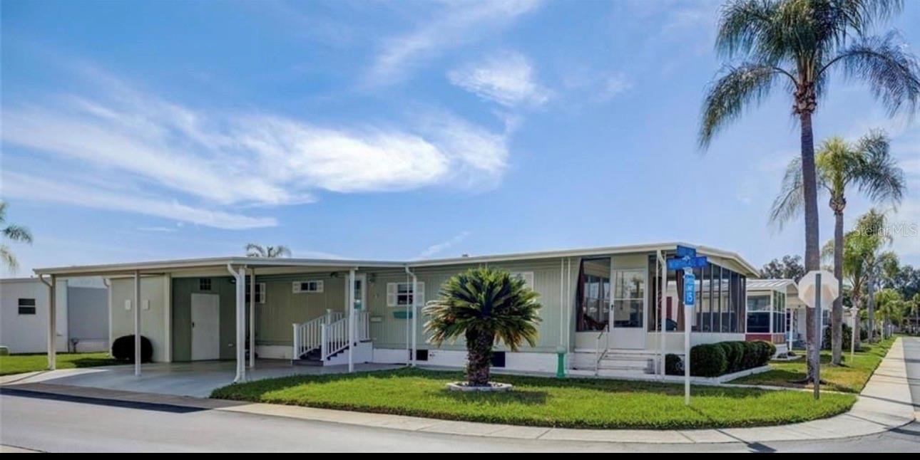Experience resort-style living in the highly desirable 55+ community of Tarpon Shores, where you own your land—no lot rent! Ideally situated just steps from the clubhouse and heated pool, and only minutes from the beach, this beautifully maintained, move-in-ready home offers comfort, privacy, and the ultimate Florida lifestyle. This tastefully furnished 2-bedroom, 2-bath residence features a desirable split-bedroom floor plan. The large living room flows seamlessly into the screened front porch through a sliding glass door, providing the perfect space to relax or entertain. Additional improvements include a spacious side-by-side two-car carport, storage shed, and beautifully landscaped oversized corner lot. Most of the furniture is included, making this truly move-in ready. Tarpon Shores is a beautifully maintained, quiet, and active community offering an exceptional array of amenities. Residents enjoy a clubhouse with a full kitchen, meeting and dance hall, heated swimming pool, covered shuffleboard courts, bocce ball, horseshoe pits, billiards, card and game rooms, library, golf and bowling leagues, and a full calendar of social events. Conveniently located near Publix, Walmart, restaurants, medical facilities, and a hospital, you’ll also be just minutes from the world-famous Tarpon Springs Sponge Docks, beautiful Gulf beaches, golf courses, parks, the historic downtown district, charming boutiques, art galleries, antiques, and waterfront dining. No flood insurance required, and outstanding community amenities, this home offers an incredible opportunity to enjoy affordable Florida retirement living. Schedule your private showing today!