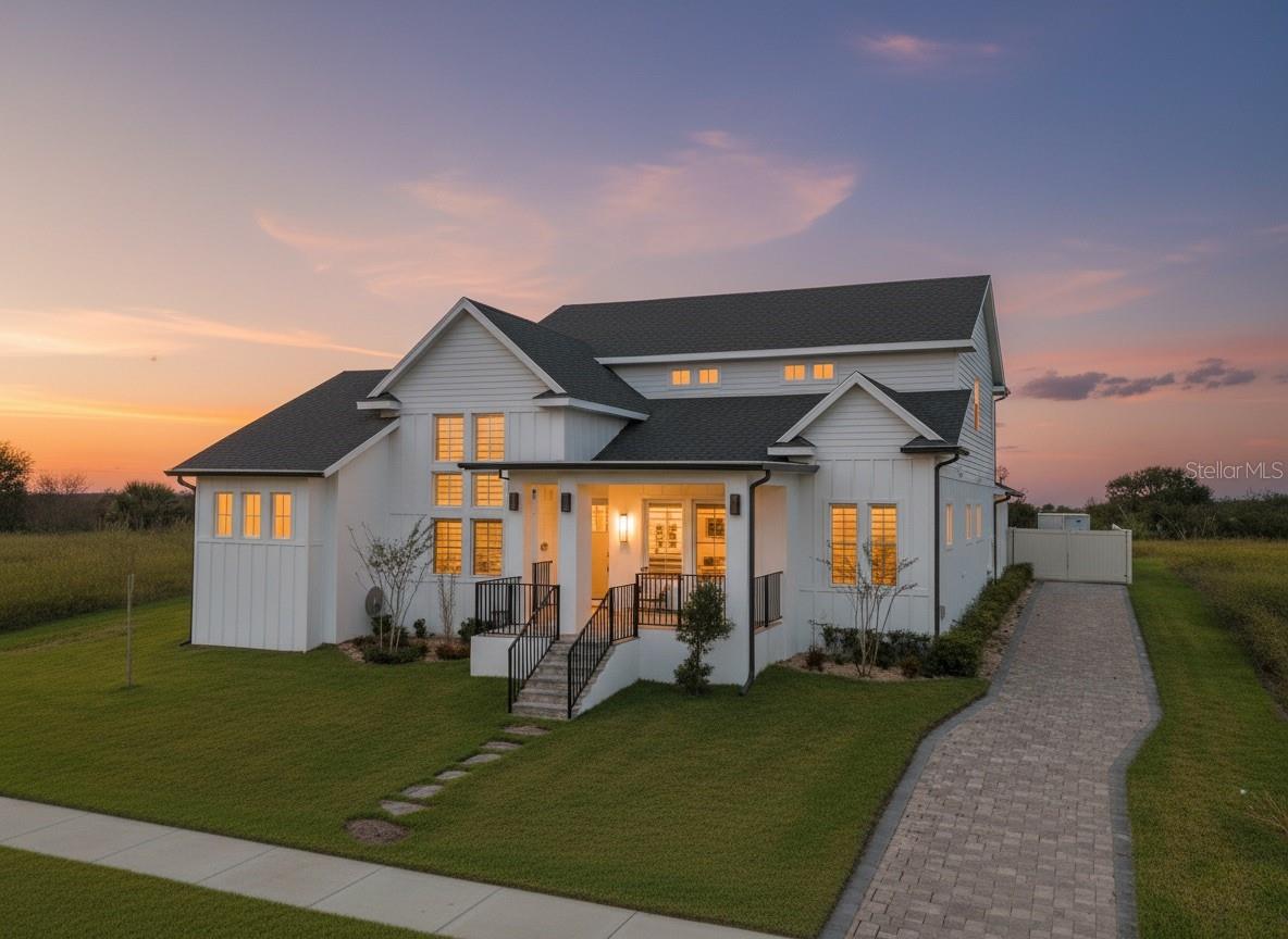 Come see this "Slice of Heaven" near the New Construction hub along N. Hancock Rd. in Minneola! Future easy access to the West Orange Trail! Make this your dream home in the gated Sugarloaf Mountain community of Minneola, perched on a high elevation along the Central Florida Ridge where luxury and craftsmanship come together. 

Built in 2022, this custom Craftsman masterpiece offers over 3,000 square feet of refined living, featuring 3 bedrooms- ALL 3 Bedrooms have ensuite bathroom and each bedroom has a HUGE Walk-In Closet (3 Primary Suites!), 3.5 bathrooms, and an impressive 4-car garage—perfect for buyers who demand both elegance and functionality.

From the moment you arrive, the home makes a statement. A lush, landscaped lawn, flagstone walkway, and classic tile rocking-chair front porch lead to a tall custom entry door, setting the tone for the craftsmanship found throughout.

Step inside and prepare to be wowed.

The main living space showcases soaring ceilings, elegant porcelain tile flooring, and a stunning modern floating wood staircase. A dramatic wall of glass floods the home with natural light while framing peaceful views of the private lanai—creating the perfect blend of indoor and outdoor living.

The chef’s kitchen is designed to impress with:
• Premium quartz countertops
• Custom all-wood cabinetry
• Built-in appliances
• Stylish granite sink
• Oversized walk-in pantry with a barn door accent

Just outside, the oversized covered lanai becomes your private resort. Enjoy evenings entertaining with a fully equipped summer kitchen, relax in the 15-jetted high-pressure spa, or gather with friends on the spacious paver patio areas.

The primary suite on the main level is a true retreat featuring:
-Oversized marble floor shower
-Dual vanities
-Private water closet
-Massive 10x12 walk-in closet with custom built-ins and natural light

Also on the main level: a private office, stylish half bath, and upgraded laundry room with sink, quartz counters, and abundant cabinetry.

Upstairs, the custom floating staircase leads to a spacious bonus room, two oversized bedrooms with walk-in closets and en-suite baths, plus an office nook. Every upstairs room enjoys spectacular sunrise views of Lake Apopka on the horizon.

This home also delivers rare high-end construction features, including:
• Dual 20 SEER HVAC systems with HALO air purifiers
• Integrated damper system & linear slot diffusers
• Spray foam insulation in roof, attic, walls, and garage
• Soundproofing for upstairs rooms
• Inspired Shade window coverings

Location is everything—and this one is exceptional. Just minutes from:
• Montverde Academy
• Green Mountain Scenic Overlook
• Lake Minneola High School
• The Clermont Chain of Lakes
• Florida’s Turnpike & Orlando attractions

Homes with this level of design, efficiency, and mountain-ridge elevation views rarely become available.

Luxury. Privacy Craftsmanship.

This is more than a home — it’s a lifestyle.

Schedule your private showing today and make this custom Sugarloaf Mountain masterpiece your NextHome.