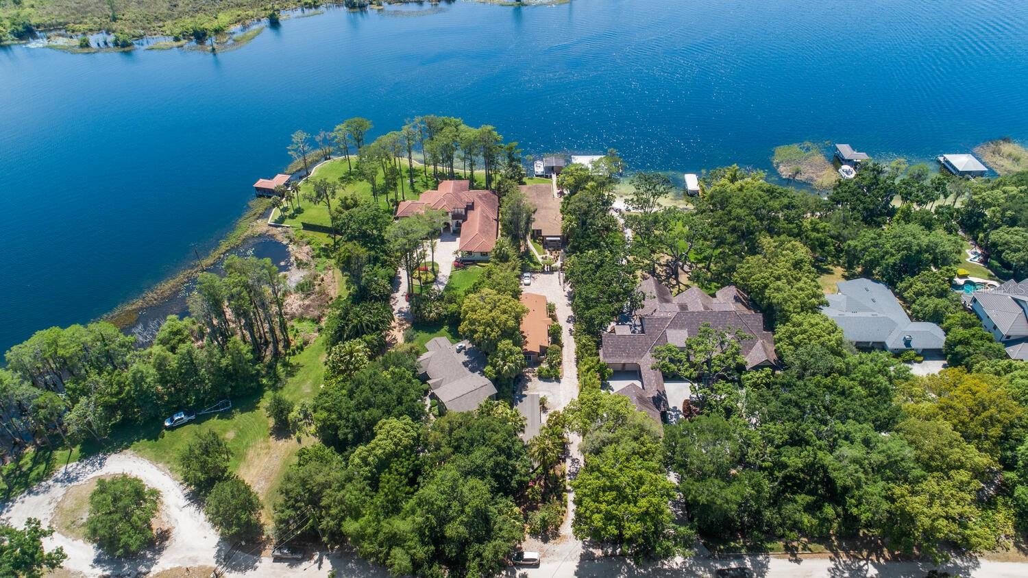 ~ MOVE IN READY~DIRECT LAKE BUTLER CHAIN OF LAKES ACROSS FROM THE FAMOUS BIRD ISLAND PRESERVE~ READY TO MOVE IN ~ DISNEY FIREWORKS SHOW EVERY NIGHT~CUSTOM BUILT BY SAMUAL OGREN ~THIS FAMILY COMPOUND IS LOCATED IN THE HEART OF HISTORIC DOWNTOWN WINDERMERE ON THE QUITE SHADED STREETS OF LAKE BUTLER~STEPS AWAY FROM THE PRIVATE WINDERMERE BOAT SLIP.~ ALL THREE HOMES HAVE BEEN RENOVATED OVER THE YEARS AND ARE MOVE IN READY.~630 BUTLER ST IS THE MAIN RESIDENCE BOASTING 2700 SQ FT WITH NEW LAMINETE WOOD FLOORS~ NEW WINDOWS AND CUSTOM BLINDS LOOKING OUT ONTO THE LAKE BUTLER ACROSS FROM BIRD ISLAND~ THE HOMES COME WITH A BEAUTIFUL PONTOON BOAT AND TRAILER~ TO CRUISE THE CHAIN OF LAKES AT SUNSET~BOAT DOCK HAS STORTAGE AND ROOM TO BBQ ON THE FAMILY GRILL~HUGE MASTER SUITE ALSO HAS LAKEVIEW AND FRENCH DOORS OUT TO THE LARGE LIVING AREA~ CUSTOM MASTER BATH WITH LARGE WALK-IN CEDAR CLOSET~ RENOVATED KITCHEN WITH ALL NEWER APPLIANCES & BREAKFAST BAR~ SET UP LIKE A DOUBLE MASTER THE 2ND BEDROOM IS VERY LARGE WITH A SPA TUB AND SHOWER~ ALSO HAS APRIVATE ENTRY AREA THROUGH FRENCH DOORS~ THE 3RD BEDROOM IS ACROSS FROM FULL SHOWER BATH FOR FAMILY OR GUEST~ PAVER DRIVEWAY AND PARKING FOR RV AND CARS~ 628 BUTLER ST IS THE COTTAGE A  TWO BEDROOM TWO BATH HOME WITH OPEN GREATROOM AND INSIDE LAUNDRY AS WELL~ MASTER BEDROOM HAS A SHOWER BATH AND PRIVATE PATIO EXIT FOR OUTSIDE VISITS~ 626 BUTLER ST THE STUDIO ONE BEDROOM ONE BATH AND LIVING AREA SEPARTE FOR GUESTS OR CARE TAKERS OF THE PROPERTY~ THE STUDIO AVAILABLE WITH FURNISHINGS & STORM SHELTER ~EXTREMELY UNIQUE PROPERTY HAS BEEN IN THE FAMILY SINCE 1950 MAKING IT ONE OWNER PERFECT WITH NO HOA~A SURVEY IS AVAILALBE UPON REQUEST~AUGUST MOVE IN~