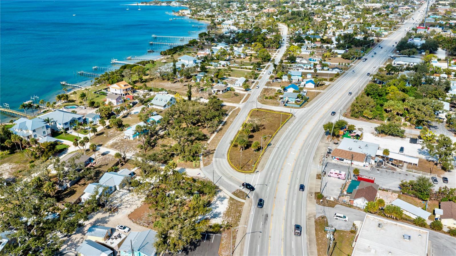 10,784 Sq. Ft. residential lot • Dual frontage on S McCall Rd & SR 776 • Public water & sewer • X500 flood zone • Near Dearborn St & Englewood Beach.


Located along the S McCall Road corridor with additional rear access on SR 776, 800 S McCall Road offers a 10,784 square foot residential lot with excellent visibility and everyday convenience. The property is mostly cleared with minimal trees and sits in an X500 flood zone, supporting a wide range of residential build options. Public water, public sewer, electric, cable, and phone are available, helping streamline future development planning. This standalone parcel is positioned close to downtown Englewood and the shops, dining, and events along Dearborn Street, with convenient access to beaches, parks, and recreation. Nearby points of interest include Englewood Beach, Bay Heights Park, Lemon Bay Sunrise Rotary Park, and Indian Mound Park. The location also provides proximity to Lemon Bay High School, the Englewood Sports Complex, and the outdoor trails and natural areas of the Myakka State Forest. Zoned residential with recommended multi-family potential per zoning, this lot combines flexible use with strong access to shopping, restaurants, and daily services along the McCall Road and SR 776 corridor.