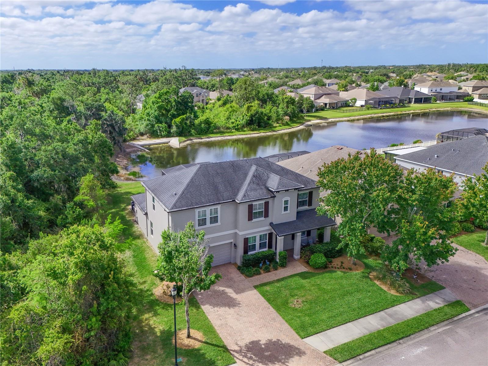 New Price ! Welcome to your private Florida retreat—where space, serenity, and scenic beauty come together. This expansive 5-bedroom, 4.5-bath home is perfectly positioned to offer rare privacy, with only one neighboring property and peaceful preserve views wrapping around the side and across the street. Out back, enjoy tranquil water and preserve vistas that create a truly breathtaking backdrop.
Step inside to find a thoughtfully designed interior featuring ceramic tile throughout the downstairs, a beautifully appointed kitchen with top of the line Kitchen Aide appliances, granite countertops, granite finishes in all bathrooms, custom decorative stair railing, and plantation shutters throughout. The outdoor living space is where this home truly shines. Imagine starting your mornings on the lanai with a cup of coffee as the sun rises over the water, and ending your evenings with cocktails by the heated pool. With a dedicated full pool bath, entertaining and relaxing outdoors is effortless. Watch birds glide across the pond and wildlife move through the preserve—your own peaceful sanctuary right in your backyard. This is more than a home—it’s a lifestyle of comfort, privacy, and natural beauty. Oakleaf Hammock is a gated community centrally located with easy access to Bradenton, Lakewood Ranch, Sarasota, St Pete, and Tampa. Schedule your private tour !