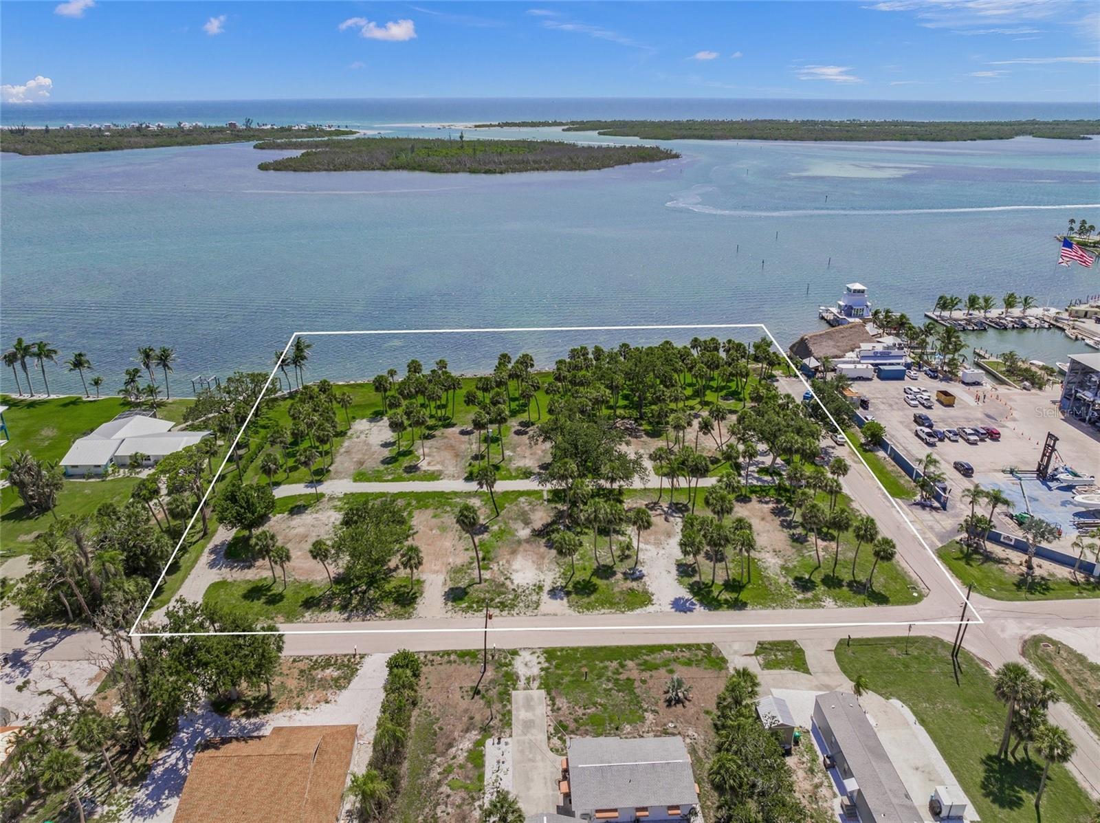 Spectacular bay front development opportunity. Over 330 feet of direct frontage on Lemon Bay with 2.3 +/- acres, zoned MHC (Manufactured Home Conventional). Gorgeous views of turquoise waters, stunning sunsets, endless wildlife, and phenomenal fishing. Potentials for subdividing into several large waterfront homesites, or developing multi-family residences. Stump Pass Marina and Lighthouse Grill are adjacent to the north and luxury residential bay front homes adjacent to the south. Multiple road frontages being on the corner of Maryland and Waterside Drive plus and Rasche Rd that runs through the property. Utility infrastructure includes 10 water meters and hookups, as well as electric service stubbed to the site. Fantastic location with the Gulf of America just minutes away, close Manasota Key and Englewood Beach, Palm Island, historic Boca Grande, Dearborn Street district, excellent dockage next door at Stump Pass Marina, lots of big shopping and restaurants close by. Englewood is a high growth area with tremendous commercial and residential development. HW41, Venice, Sarasota, and North Port are quick, easy drives to the north.