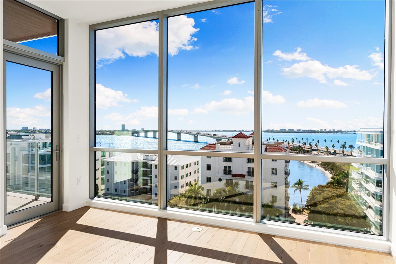 Why wait to build when perfection is already here? Penthouse 701 at The Evolution is move-in-ready new construction that delivers high-end finishes, iconic views, and effortless comfort, all without the wait. With 3,460 square feet of interior space and two private terraces, this 4-bedroom, 4.5-bath home was designed by Mark Sultana to maximize natural light, flow, and function. The gourmet kitchen features a 14-foot quartz waterfall island, Sub-Zero and Wolf appliances, Italian cabinetry, and a built-in Wolf coffee station. Floor-to-ceiling windows frame sweeping views of Sarasota Bay and the Ringling Bridge. The primary suite offers spa-level luxury with a soaking tub and dual rainfall showers. Set in a boutique building of just 20 residences, you’ll also enjoy rooftop sunset views, a cabana-lined pool, sauna, fitness center, concierge services, and a private deeded 2-car garage. Let’s schedule your private tour and show you how easy luxury living can be....no construction required.