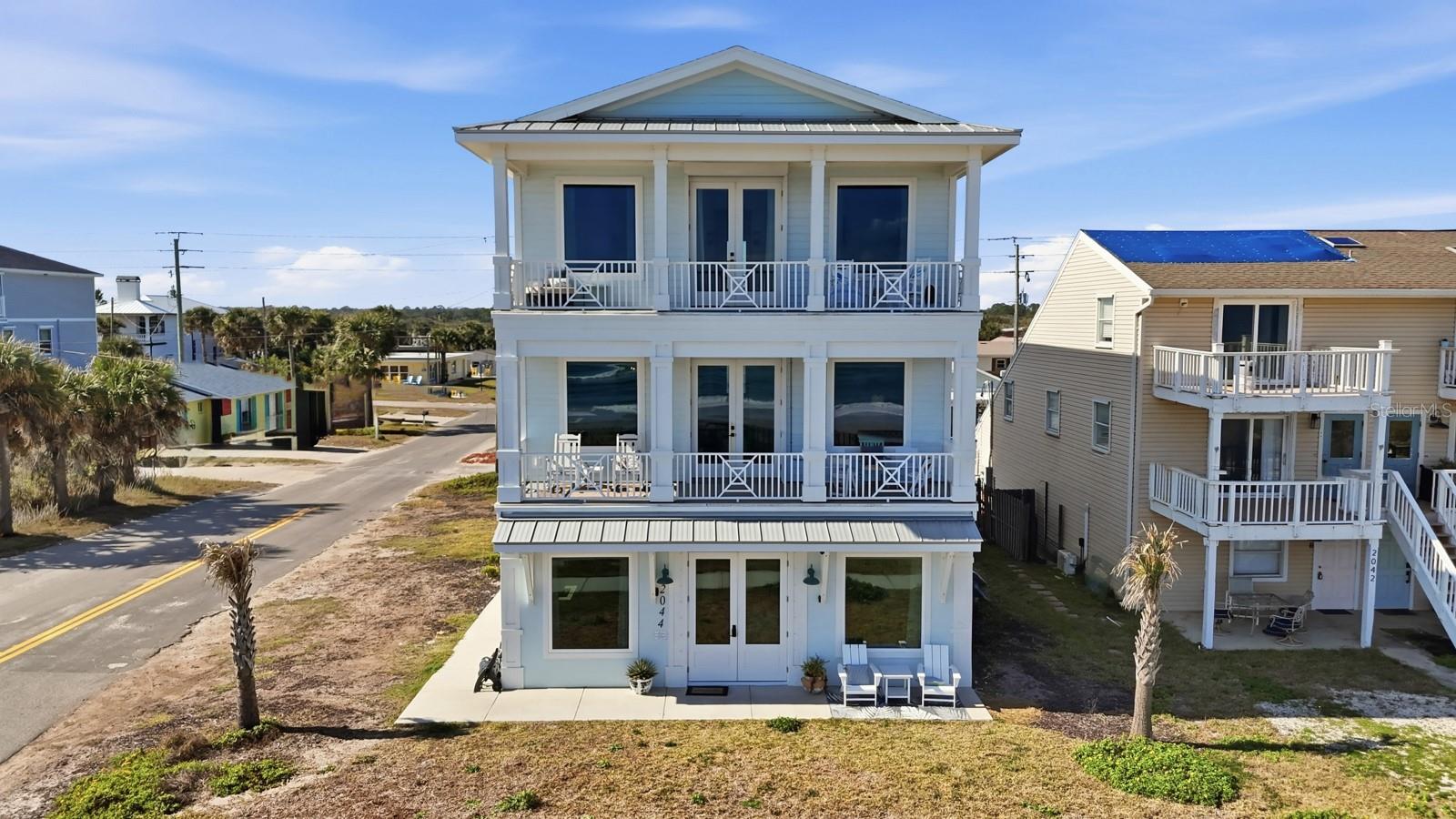 2044 South Oceanshore Boulevard in Flagler Beach, Florida is a rare opportunity to own a newly built, three story coastal property designed around flexibility, income potential, and lifestyle.
Completed in 2024, this 3,706 square foot property includes six bedrooms and five bathrooms across three fully independent residential units. Each unit occupies its own floor, features a separate private entrance, and functions as an individual residence. This design allows the property to be lived in, rented long term, rented short term, or operated as a combination of all three.
Whether you choose to live in one unit and rent the others, operate all three as short term rentals, hold them as long term income producing leases, or mix strategies over time, this property provides options that are increasingly difficult to find in Flagler Beach.
The first floor offers approximately 1,170 square feet and includes garage access. The second and third floors each provide roughly 1,300 square feet and feature both front facing and rear balconies, creating functional indoor outdoor living on every level. Each unit is thoughtfully laid out to support privacy, usability, and independent living.
An elevator shaft has already been framed and pre plumbed, allowing for future installation without structural changes. Interior finishes are clean, modern, and refined, reflecting the advantages of new construction where nearly everything is new.
Situated on a corner lot along South Oceanshore Boulevard, the property offers added presence, natural light, and privacy. This is a true one of one build and currently the only property of its kind available on the market in Flagler Beach.
For buyers seeking a Flagler Beach investment property, a multi unit coastal home, a short term rental opportunity, or a primary residence with built in income potential, this property delivers versatility, modern construction, and long term value in a highly desirable coastal location.
