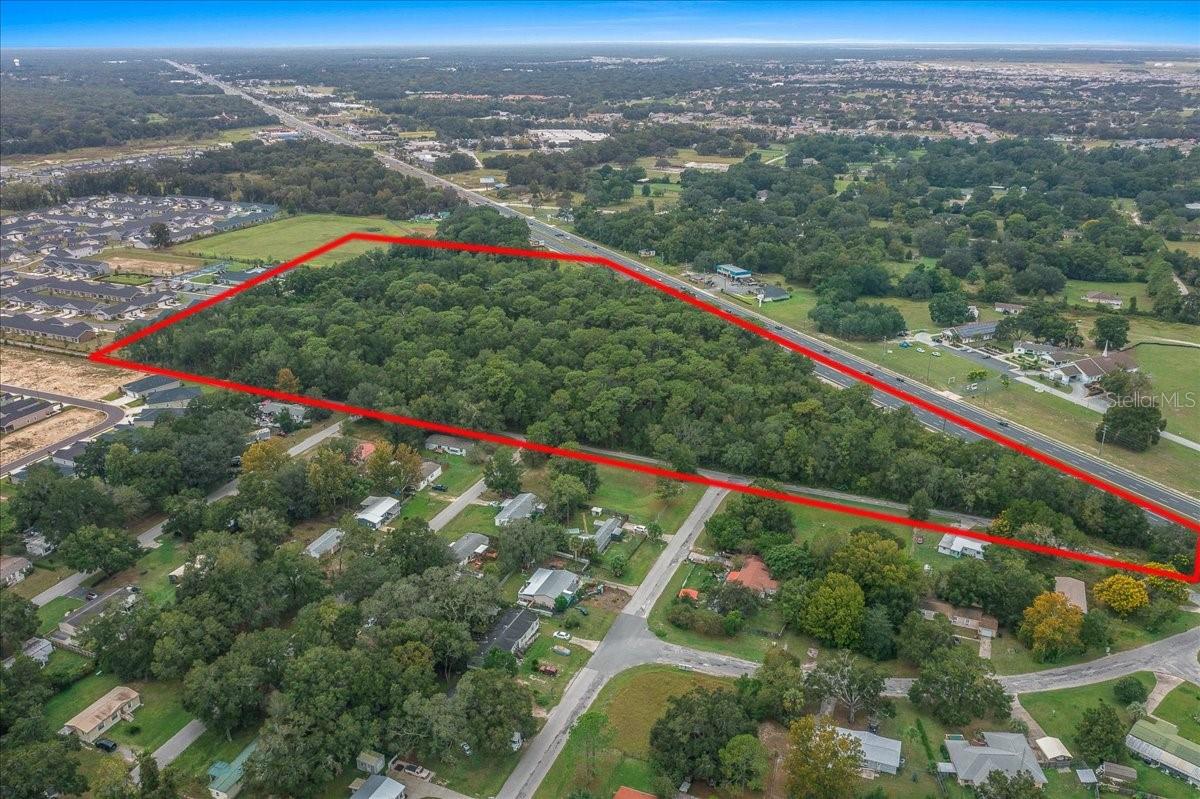 7172 SW HWY 200 presents a rare opportunity to secure a prime commercial development site in the center of Ocala’s explosive growth corridor. Spanning 16.39 acres with more than 1,000 feet of frontage directly on highly traveled SR-200, this B2-zoned property offers exceptional visibility, accessibility, and positioning for a wide variety of commercial ventures.

Surrounded by major residential communities, expanding infrastructure, and nationally recognized employers, this location places your future project in the path of continued growth and demand. Just minutes away are FAST (Florida Aquatics Swimming & Training), On Top of the World, Ocala Logistics Park featuring Amazon, Chewy, and FedEx, Ocala International Airport, and the World Equestrian Center. The property also offers convenient access to I-75, medical facilities, retail centers, and The Villages.

B2 Community Business zoning allows flexibility for retail centers, restaurants, medical or professional offices, mixed-use concepts, service businesses, and more. With strong traffic counts, outstanding road presence, and utilities nearby (buyer to verify), this site is ideally suited for developers, investors, or end-users seeking a high-profile location in one of Central Florida’s fastest-growing markets.

Opportunities with this level of exposure and growth potential are becoming increasingly limited along SR-200. Explore the possibilities and envision what your next successful project could become at this exceptional Ocala location.