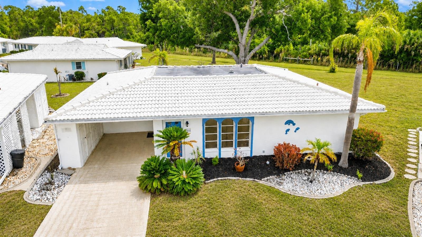 This clean and well-maintained furnished villa backs up to peaceful greenbelt views, offering added privacy in the desirable Circle Woods community, complete with a community pool and spa. New updates include a NEW HVAC system (2024), re-lined sewer pipe (2025), and an updated electrical panel (2020), offering peace of mind for years to come. Inside, tile flooring runs throughout the main living areas, including the living room, dining area, kitchen, and spacious family room. This desirable floor plan offers a seamless flow, perfect for both everyday living and entertaining. The kitchen is enhanced with granite countertops and crown molding accents compliment the main living space, adding a custom touch. Additional built in cabinetry in the laundry room provides extra storage and convenience. The carport is a standout feature, offering a partially enclosed side wall with built-in cabinetry—perfect for added privacy and ample storage. Enjoy easy Florida living in a well-kept community with great amenities and a private, serene backyard setting. Located in an X flood zone so no flood insurance required with most loans and no CDD fees. The monthly fees also includes yard and exterior maintenance in addition to cable TV. Conveniently located just under 4 miles to the gorgeous Manasota Key Beach and a short drive to the Historic Downtown Venice with boutique shops, sidewalk cafes and the Venice Preforming Arts Theater. Or under 7 miles to Wellen Park with the Atlanta Braves Spring Training Facility. This wonderful villa provides an ideal location combined with low maintenance living and amenities for easy Florida living.