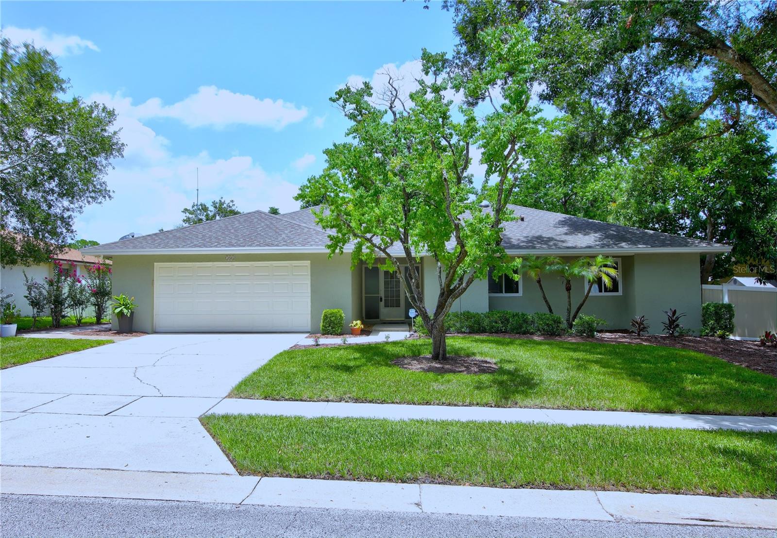 Under contract-accepting backup offers. Welcome to this meticulously maintained, move-in-ready home featuring 3 bedrooms, 2 bathrooms, and a dedicated home office complete with custom built-in desk and credenza. Located in The Crossings, one of Lake Mary's most sought-after communities, this exceptional property perfectly blends luxury, comfort, and everyday convenience. Ideally situated just minutes from I-4, SR 417, and Lake Mary Boulevard, you'll enjoy quick access to an abundance of shopping, dining, entertainment, and top-rated amenities. The home is also zoned for the highly acclaimed Lake Mary school district, making it an outstanding choice for families. Inside, you'll find quality craftsmanship and upscale finishes throughout. A major renovation includes Simonton double-pane vinyl windows and an upgraded LED lighting package featuring recessed lighting, pendant fixtures, and under-cabinet illumination. The heart of the home is the impressive chef's kitchen, thoughtfully designed for both everyday living and entertaining. It boasts a large center island with seating, 42-inch maple cabinetry, quartz countertops, designer tile backsplash, farmhouse stainless steel sink, spacious 5-foot serving bar, pantry, and an upgraded 5-burner gas cooktop with electric convection oven. The flexible floor plan includes a secondary bedroom with a custom built-in Murphy bed and cabinetry, providing the perfect guest room or multipurpose space. Premium flooring includes COREtec luxury vinyl plank throughout the main living areas and primary suite, plush carpet in the secondary bedrooms, and large-format tile in the bathrooms and office. Every closet has been upgraded with premium white shelving for exceptional organization. Both bathrooms have been beautifully updated with cherry wood vanities, solid surface countertops, and modern fixtures. Major improvements provide lasting value and peace of mind, including a new 30-year architectural roof (2022), gas water heater (2025), and freshly painted exterior. Step outside to your own private backyard retreat featuring 6-foot vinyl privacy fencing, an expansive 600-square-foot paver patio, a 7-foot spa, paver fire pit, and a paver walkway connecting the backyard to the front of the home. Professionally landscaped grounds create outstanding curb appeal, while the garage offers an epoxy-coated floor and two built-in workbenches—perfect for hobbies, projects, or additional storage. Additional premium features include whole-home generator wiring with natural gas hookup and hurricane shutters throughout, offering added security and convenience. This exceptional home has been thoughtfully upgraded from top to bottom and offers the perfect combination of luxury finishes, functional design, and an unbeatable Lake Mary location. Simply move in and start enjoying everything this remarkable property has to offer.