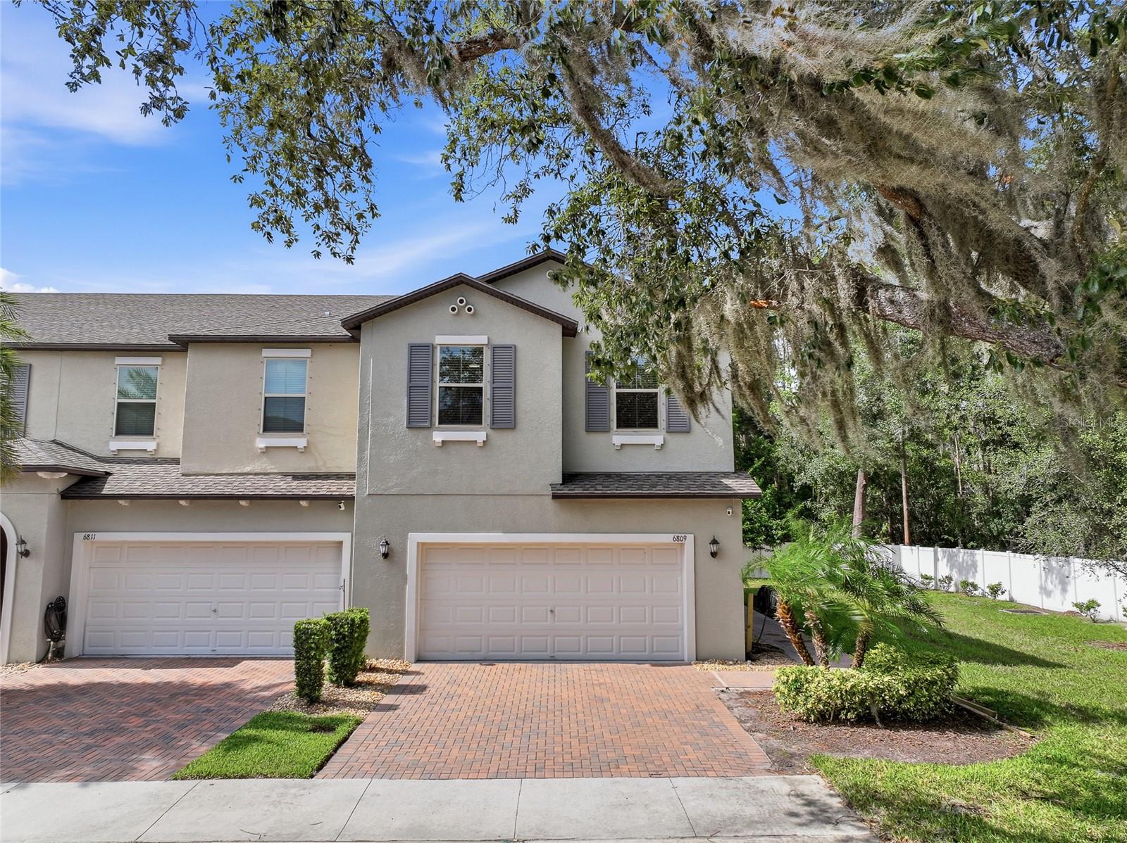 Get ready to fall in love with 6809 Via Perloso Court—a rare gem in the intimate Avesa community of just 61 homes! This stunning 4-bedroom, 3-bathroom end-unit was built in 2020 and lives like a single-family home, delivering all the space you crave with the low-maintenance perks of a premier gated neighborhood. Need room for guests or multigenerational living? You’ll love the first-floor bedroom and full bath—a coveted feature offering ultimate flexibility and convenience right where you want it. Tucked away on a private conservation lot, this beauty greets you with a bright, open floor plan made for both entertaining and everyday living: a spacious loft, a show-stopping chef’s kitchen with island seating, gleaming granite countertops throughout, and double sinks in both the primary AND secondary bathrooms. Upstairs, the dreamy primary suite wows with dual closets and an oversized bonus room ready to become your home office, workout space, or private escape. Speaking of workouts—the garage is a total game-changer, professionally painted with sleek epoxy floors and fully outfitted as a home gym. Best of all, this home is loaded with smart, money-saving upgrades: a paid-off water softener, reverse osmosis system, exterior Ring security cameras, and generator-ready infrastructure, all backed by documented semi-annual water heater and HVAC servicing. Location? Unbeatable. Sitting right off the Veterans Expressway, you’re just minutes from Tampa International Airport, downtown Tampa’s buzzing scene, and the sparkling beaches of St. Petersburg. And the Avesa lifestyle keeps getting better with a reasonable HOA that covers it all—comprehensive insurance, 24-hour gated security, a resort-style pool, private roads, lush landscaping, professional management, and structural insurance—plus total peace of mind with zero hurricane damage or flooding history. Homes in this exclusive 61-home enclave don’t come along often—don’t miss your chance to make this one yours!