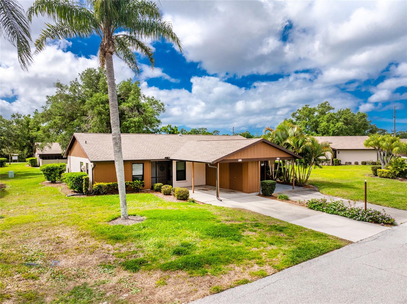 New Price! Welcome home to your updated, turnkey furnished, 2-bedroom, 2-bath villa offering effortless, low-maintenance living in a desirable 55+ community. From the moment you step inside, you’re greeted with an open, light-filled layout featuring vaulted ceilings and a seamless view through the living space to the oversized lanai and private, fenced, paver backyard —perfect for relaxing or entertaining. The thoughtfully updated kitchen (2023) showcases modern finishes, soft-close cabinetry, newer appliances, and plank tile flooring creating a stylish and functional heart of the home. Both bathrooms were partially updated as well with new cabinetry and soft close drawers. The plank tile is carried throughout the home except for laminate in the 2 bedrooms. Maintenance is simple and the look is clean and contemporary. The primary suite offers comfort and convenience with dual closets featuring adjustable shelving, an en-suite bath, and direct access to the lanai — your own private retreat. Major updates have already been taken care of, including UV light bulb replaced on HVAC (2025); New roof with extended gutters and leaf guards (2024); Washer & dryer (2022); Impact windows (2018); Water heater (2017). Located in Flood Zone X where current owners are not required to carry flood insurance. Enjoy true peace of mind with an HOA that covers basic cable TV, exterior maintenance (including roof and paint), lawn care, and a community pool — all designed to make everyday living easy. There is a residents storage area for RV or Boats. Current owners graveled their storage space for an RV. This is the perfect blend of comfort, convenience, and coastal living—just bring your suitcase and start enjoying yourself. Curry Cove is located just minutes from it all: under 4 miles to Venice and Nokomis Beaches, approximately 2.5 miles to the Legacy Trail, close to dining, shopping, and golf.