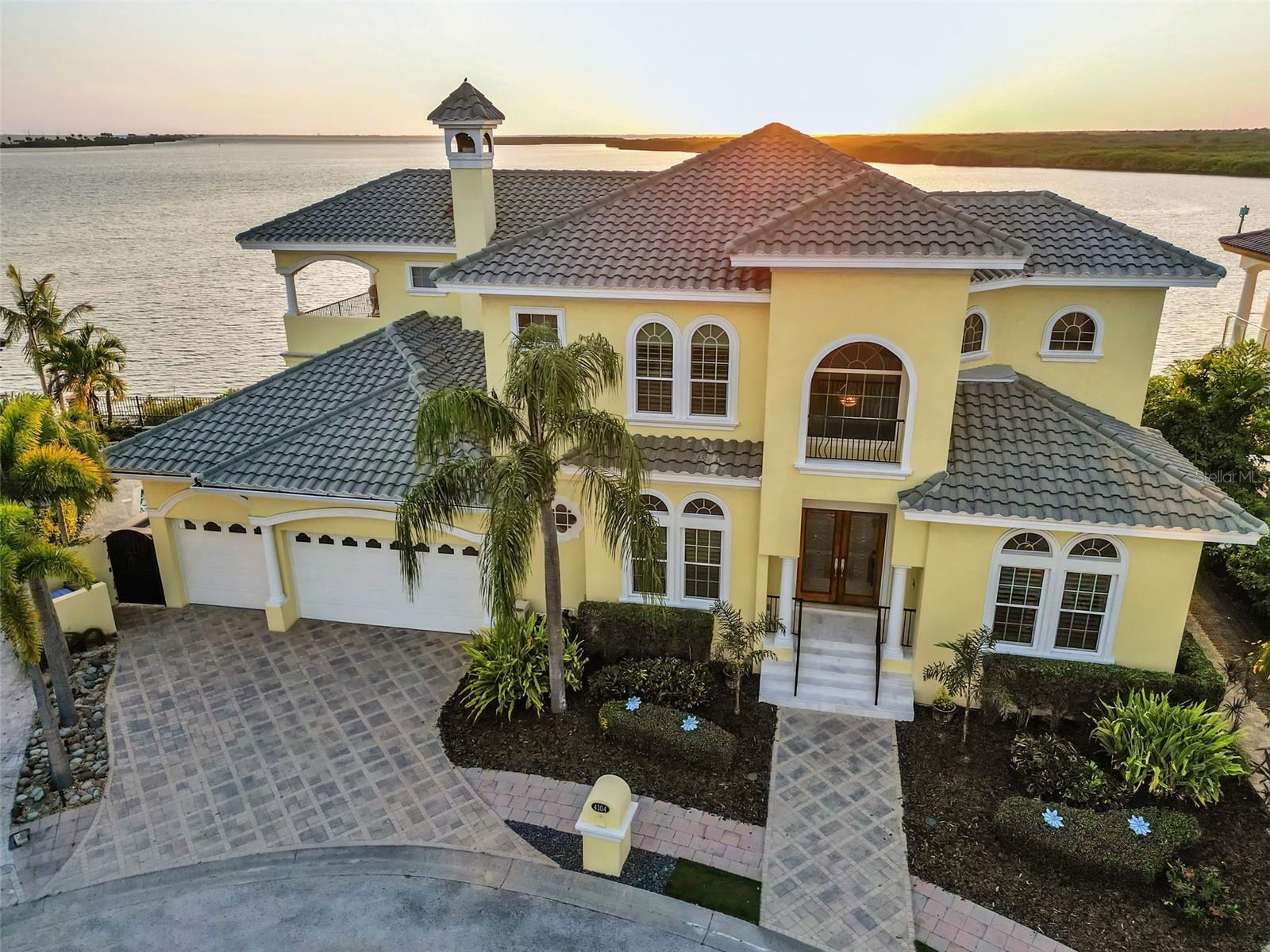 NO FLOODING / STORM DAMAGE from EITHER Hurricane!   Rest assure your new home was built to withstand the two largest disasters in Tampa Bay History!   Witness some of the most Captivating Sunsets and Open Water views in all of Tampa Bay!  This Stunning waterfront residence located in the prestigious Reserve of Old Tampa Bay, a secluded gated enclave conveniently close to TIA, downtown Tampa, and St. Petersburg. Crafted by Alvarez, this home boasts over 130 feet of water frontage, providing spectacular sunsets year-round. A spacious chef’s kitchen features top-tier appliances and a walk-in pantry, while the expansive master suite includes dual bathrooms and closets, a steam shower, and a whirlpool tub. Outdoors, a generous pool with cascading waterfalls awaits, alongside amenities such as a whole-house audio system, Lutron lighting, two fireplaces, a 500-bottle wine cellar. Custom cabinetry adorns every space, complemented by an outdoor kitchen and a separate-entry exercise room. Enjoy the spectacle of dolphin and manatee sightings from two lanais overlooking the serene waters of Tampa Bay, complete with a sizable dock and 13k lb boat lift. See Feature sheet attached for additional information regarding the property.  Custom Furniture & personal property also negotiable.