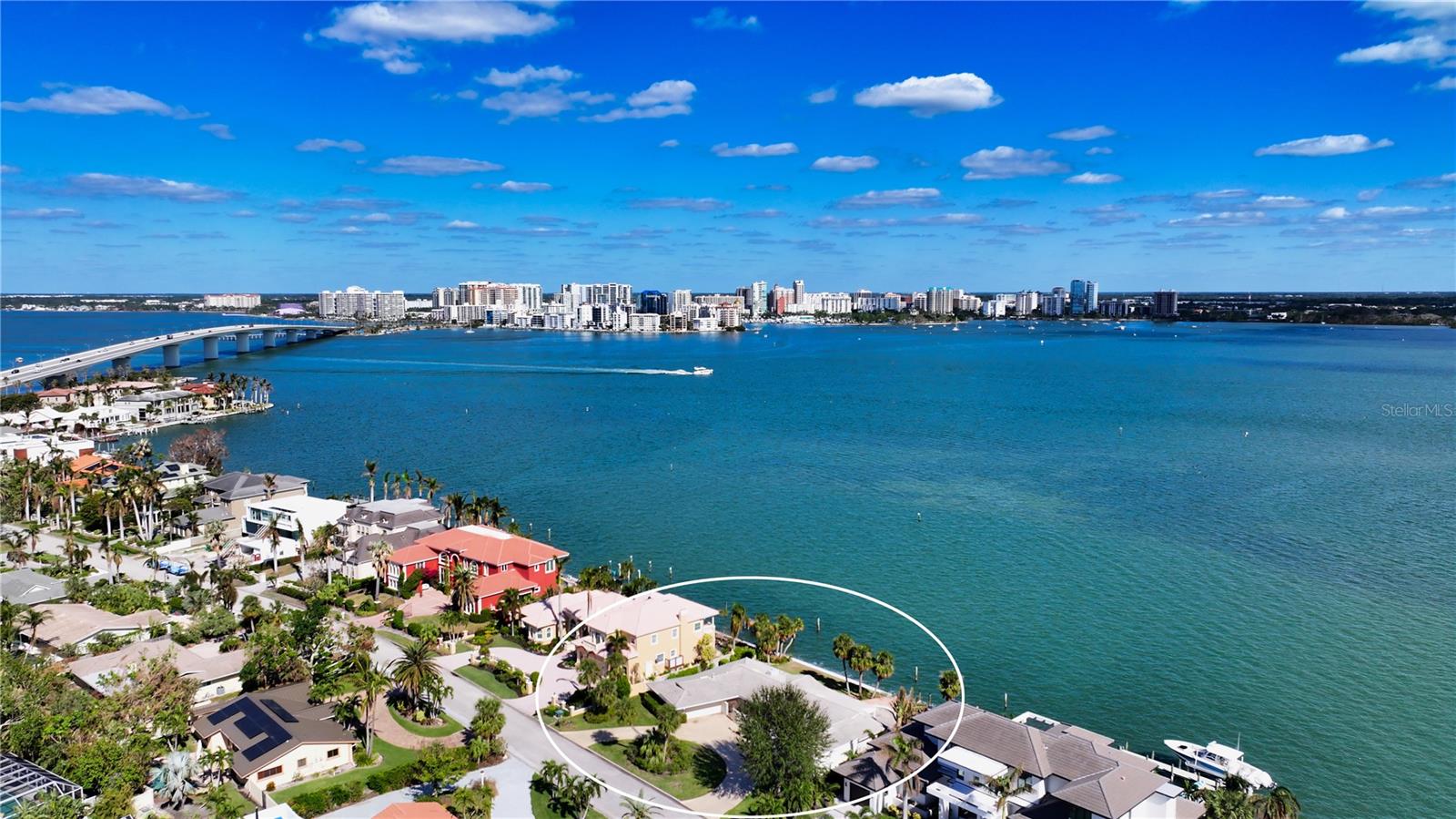 Showcasing spectacular views of Sarasota Bay and downtown, this exceptional bayfront property in the prestigious Bird Key community offers a rare opportunity to craft a custom home tailored to your vision. Perfectly positioned for boating enthusiasts, the property features 120 feet of direct bay frontage, new seawall in 2021, seamless access to Sarasota Bay, Big Pass, and the Gulf of Mexico, making it a true boater’s haven. This prime location is ideal for enjoying sweeping bay and city vistas, basking in the Florida sun, and embracing the refreshing bay breezes. Whether you’re hosting an elegant gathering or simply relaxing, this setting provides an unparalleled backdrop for waterfront living. Bird Key is celebrated as Sarasota’s crown jewel, perfectly situated between the vibrant downtown and the upscale charm of St. Armands Circle. Its exclusive community offers a lifestyle of sophistication and convenience. Enhance your luxury waterfront living experience with membership to the Bird Key Yacht Club, where you can enjoy fine dining, engaging social events, a fitness center, tennis courts, swimming, and private docking for your boat. For outdoor enthusiasts, Bird Key Park is just a short, sun-filled bike ride away, providing an ideal spot for picnics, paddleboarding, or simply soaking in the coastal beauty. This property offers not only a premier location but also the opportunity to create a truly extraordinary residence in one of Sarasota’s most sought-after neighborhoods.