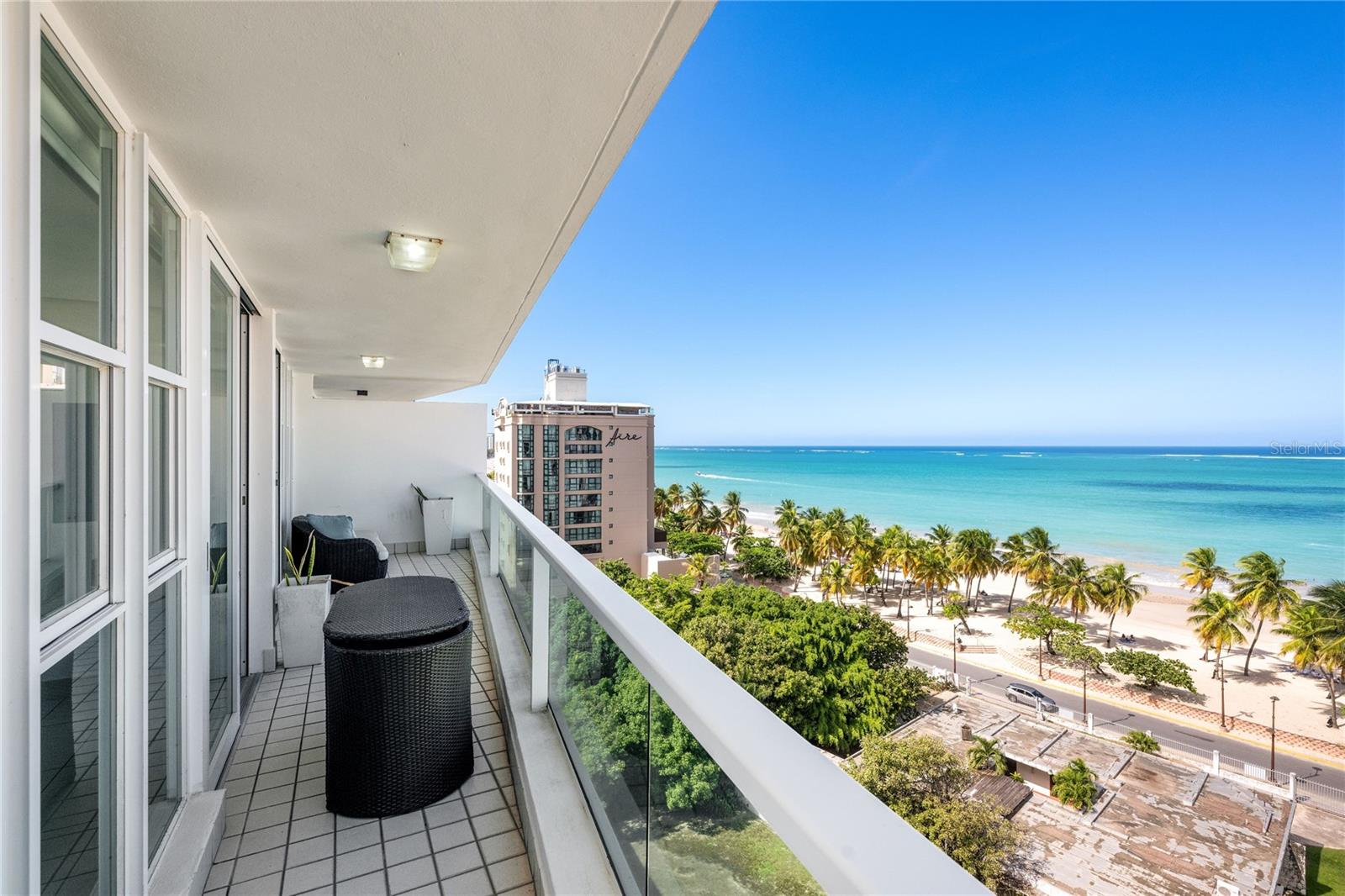 This stunning beachfront condominium in Isla Verde offers 1,800 sq. ft. of well-designed living space, capturing the comfort and beauty of this beachfront property. The layout features 3 bedrooms / 2.5 bathrooms, and is sold fully furnished, truly turn-key. Large windows and sliding doors invite natural light throughout the open living areas, creating an airy atmosphere that complements the home’s oceanfront setting.
At the heart of the residence is a thoughtfully crafted kitchen with granite countertops and a matching kitchen island, offering ample workspace and the main focal point for gatherings. Complete with GE Profile appliances, including an oven microwave, refrigerator, cooktop, and dishwasher, the kitchen blends performance and design for everyday living. Its open-plan layout connecting to the dining and living spaces makes entertaining both easy and enjoyable.
The primary suite serves as a private retreat, featuring an en-suite bathroom and a large walk-in closet for optimal comfort and storage. Whether waking up to the sound of the waves or unwinding at the end of the day, this suite provides ideal tranquility. The Jack-and-Jill bedrooms offer options for additional family members or guests.  
With its prime beachfront location and well-appointed interior, this 11-story condominium also offers a beautiful pool and luxurious fitness center. A rarity in Isla Verde, this building offers full generator and cistern. 
Ocean View 904 and apartment Ocean View 903 next door, are both currently on the market separately. However, this is also a rare opportunity to acquire side-by-side ocean front properties together allowing the possibility for roughly 3,600 sq ft of living space and 5 bedrooms and 6 bathrooms. Call for more information.