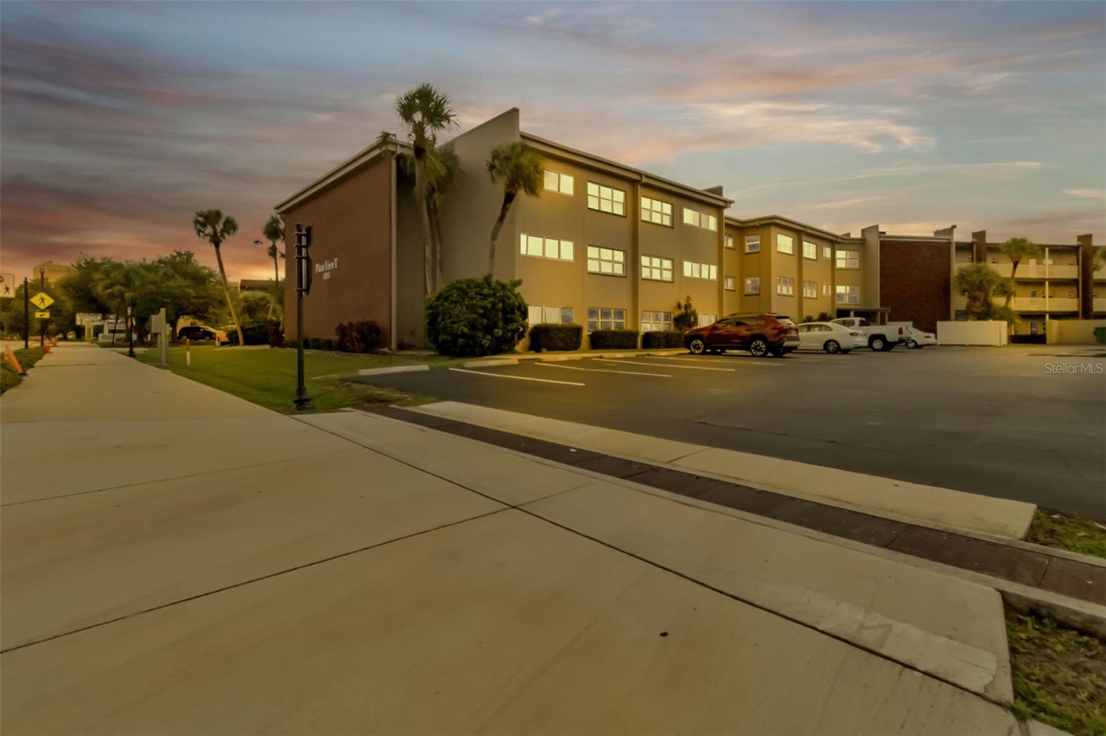 MOVE IN READY and affordable 2nd floor condo in the heart of the medical district in Port Charlotte.   This well-maintained 1 bedroom condo has plenty of space to add a pull out couch or a privacy screen and a bed in the Florida/Bonus room.  It is bright and airy, and feels larger than the square footage indicates.  The kitchen has granite counters and ample cabinets.  The unit comes with a dedicated parking space and the complex has guest parking too. Exterior windows are impact resistant and FEMA shows that it is NOT IN A FLOOD ZONE (X). Conveniently located in the Parkside District, you are close to hospitals, shopping, grocery stores, restaurants and recreational activities such as boating, fishing, golfing, Charlotte Harbor access & pickleball courts. Enjoy the community pool and laundry facilities as well as locked access entry points. Only residents and their guests can access the property. There are a few common areas to relax and converse with your friends & neighbors as well as a few pieces of exercise equipment for resident usage. Basic cable, wifi & water/sewer is included in the monthly fee. Several Gulf beaches are approximately 45 minutes away. Fishermen's Village & downtown Punta Gorda is approximately 12 minutes south and Sunseeker Resort is just before that. GREAT OPTIONS FOR ENTERTAINMENT AND FIRST CLASS DINING.  Make an appointment TODAY to see this adorable and affordable residence.