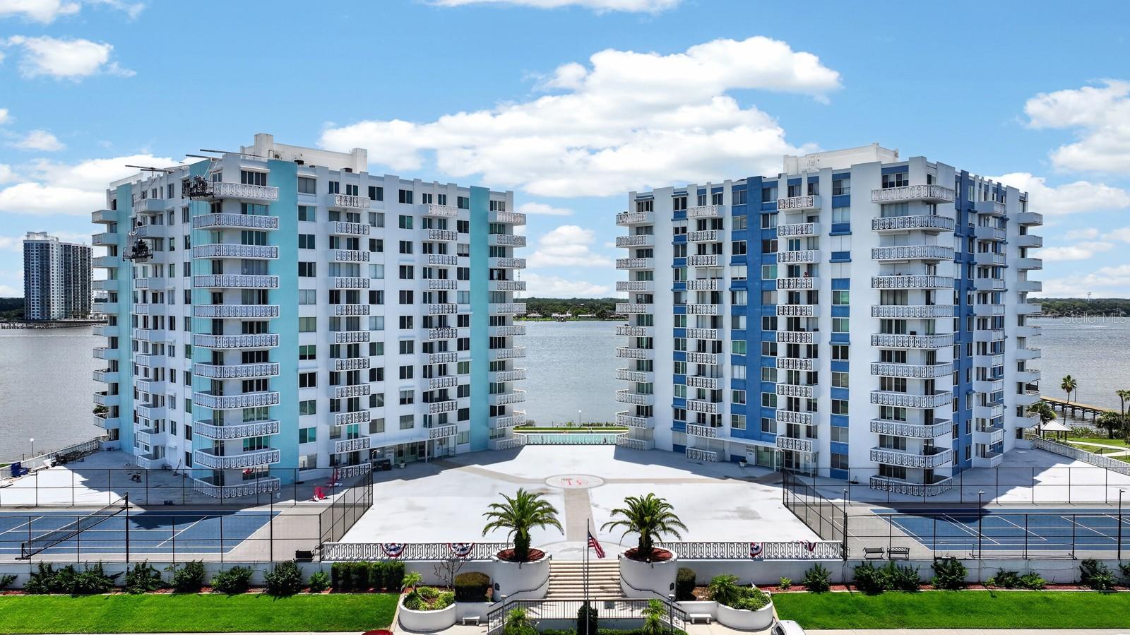 Welcome to your own slice of coastal paradise at Bayshore Bath & Tennis Club! This beautifully updated fourth-floor, two-bedroom, two-bath residence offers over 1,200 square feet of inviting living space designed for comfort and style. The heart of the home is the designer kitchen, featuring quality finishes, abundant cabinetry, and an open layout that's perfect for entertaining. Tropical-inspired tones and designer finishes create a warm, relaxing atmosphere that perfectly complements the Florida lifestyle. Step outside to the spacious wraparound balcony and take in sweeping views stretching from the tranquil Halifax River to the sparkling Atlantic Ocean. Whether you're enjoying your morning coffee, watching boats glide by, or taking in colorful evening skies, this outdoor living space is sure to become your favorite retreat. With generous room sizes, tasteful updates, and resort-style amenities, this Bayshore condominium offers the perfect blend of waterfront beauty, comfort, and coastal elegance. Enjoy a heated waterfront pool, tennis and pickleball courts, a fitness center, fishing dock, clubhouse, and the relaxed, maintenance-free lifestyle that makes Bayshore one of the area's most desirable waterfront communities. Come experience the Bayshore lifestyle and discover why so many are proud to call it home. Schedule your private showing today! All information taken from the tax record, and while deemed reliable, cannot be guaranteed.