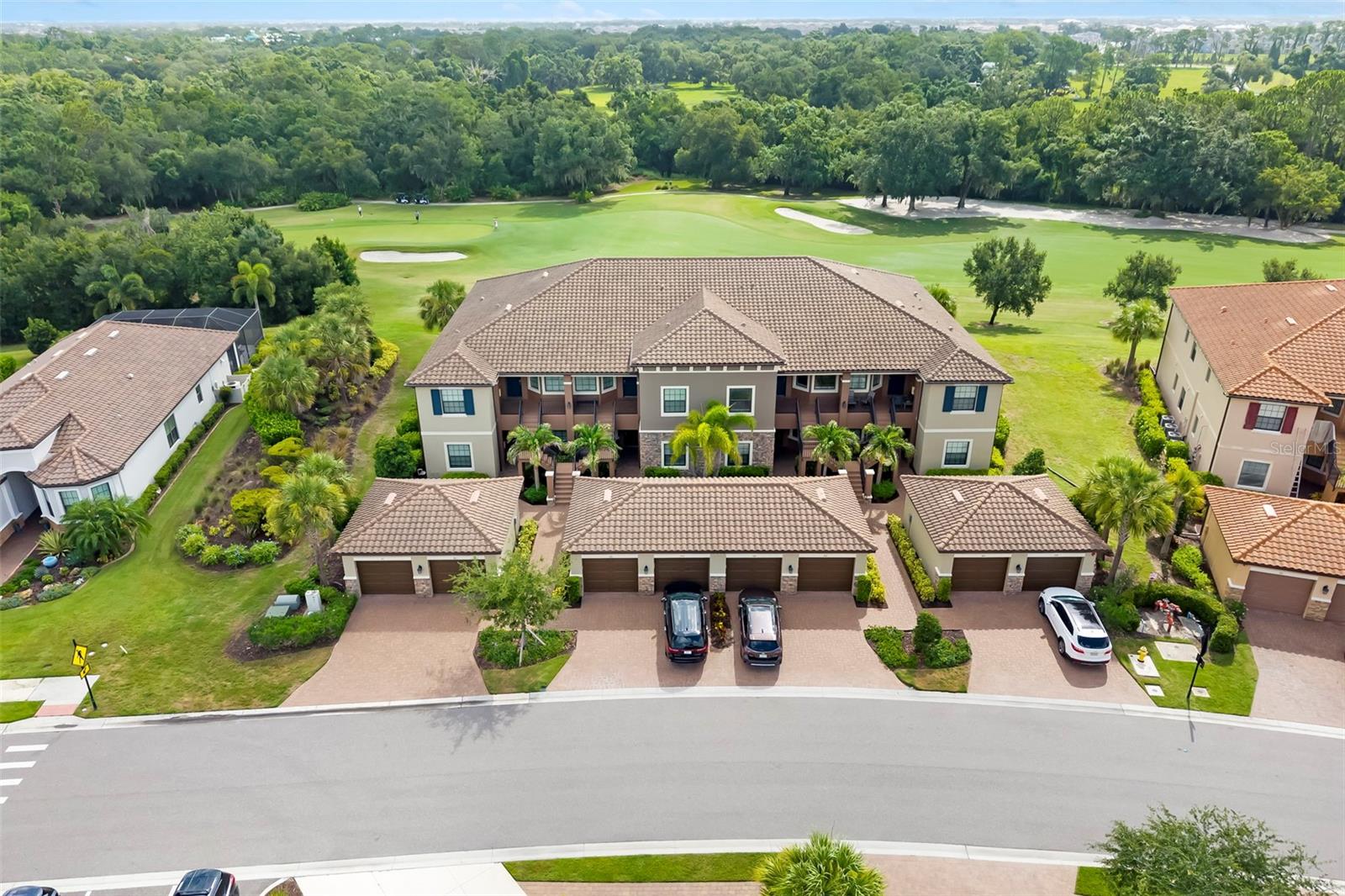 Experience maintenance-free luxury living in this beautifully upgraded first-floor condominium in the highly sought-after Esplanade Golf and Country Club at Lakewood Ranch, where a full golf membership is included. Offering 1,528 square feet of thoughtfully designed living space, this two-bedroom, two-bath residence with a one-car garage enjoys picturesque golf course views with a tranquil preserved greenbelt beyond, creating the perfect backdrop for everyday living. Inside, an open-concept floor plan filled with natural light and enhanced by a custom stone accent wall with a built-in electric fireplace adds warmth and character to the living area and den. The spacious kitchen flows effortlessly into the dining and great room, making the home ideal for entertaining or simply enjoying the relaxed Florida lifestyle. The split-bedroom layout provides privacy for owners and guests alike, while the spacious primary suite offers a peaceful retreat. Outside, the screened lanai is the perfect place to enjoy your morning coffee or unwind in the evening while overlooking the fairway and natural preserve beyond. Ownership includes a bundled full golf membership, providing immediate access to Esplanade's championship 18-hole golf course, practice facilities and an unmatched collection of resort-style amenities. Residents enjoy a spectacular clubhouse, a resort pool with the Bahama Bar, a Barrel House Bistro, a state-of-the-art fitness center, tennis, pickleball, bocce, scenic trails and an active year-round social calendar. Ideally located in the heart of Lakewood Ranch, you're just minutes from Waterside Place, Lakewood Ranch Main Street, University Town Center, world-class dining and shopping and Florida's renowned Gulf Coast beaches. This is more than a home; it's the resort lifestyle you've been waiting for.