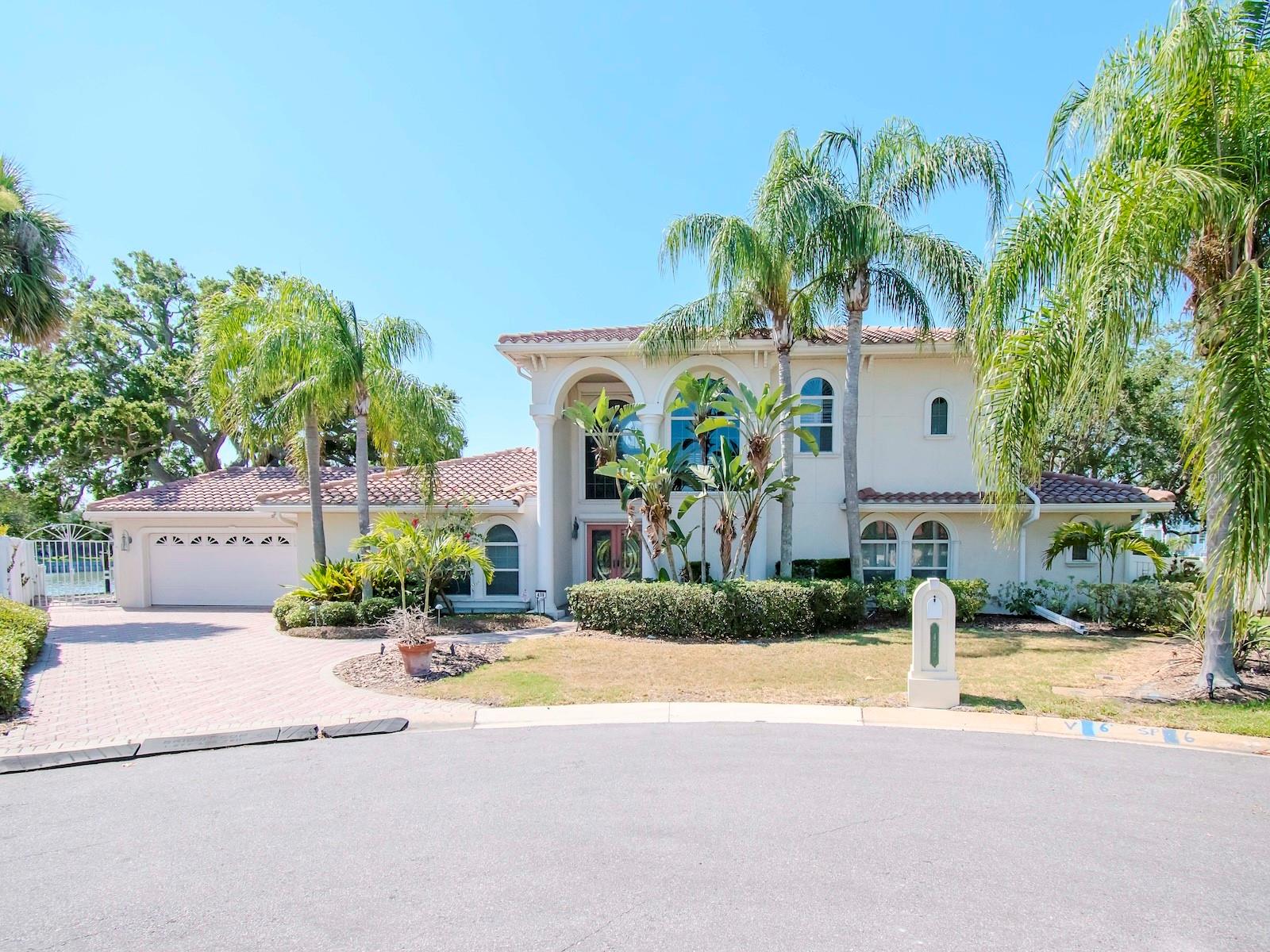 Unique Home on a Remarkable Waterway. A boater's dream!  The waterfront accommodates a yacht up to 70 feet in length, with a new boat lift for vessels up to 34 feet (never used) and a second lift for boats up to 18 feet. The dock, one of the ten largest residential docks in Pinellas County, offers over 200 feet of waterfrontage with a new seawall, providing ample backyard space to bask in the Florida sunshine. The large backyard features a blend of sunlit spaces and shaded areas under the majestic grandfather oaks.  Inside you will find a spacious home with 3 bedroom, 2.5 baths, family room, living room, game room, exercise room and more. The master retreat spans the entire second level, featuring a spacious en-suite bath, custom closet treatments, and an in-room coffee service bar with a sink. Swing open the French doors of the master suite to enjoy the expansive balcony overlooking the pool and waterfront.
Downstairs, entertain guests in the billiard room, highlighted by a mesmerizing 450-gallon custom saltwater aquarium. The living room offers a custom bar with a keg cooler.  Some additional features you'll find: Whole house generator (Generac), storm shutters, 2 custom commodes with lighting/bidet/auto open & close/heat, additional mini-splits in bedrooms, tankless water heater, and more.
This home is brimming with too many features to list and is certainly worthy of a personal visit. Don’t miss the chance to make this extraordinary property your home – one of the finest waterfront locations available in the area.