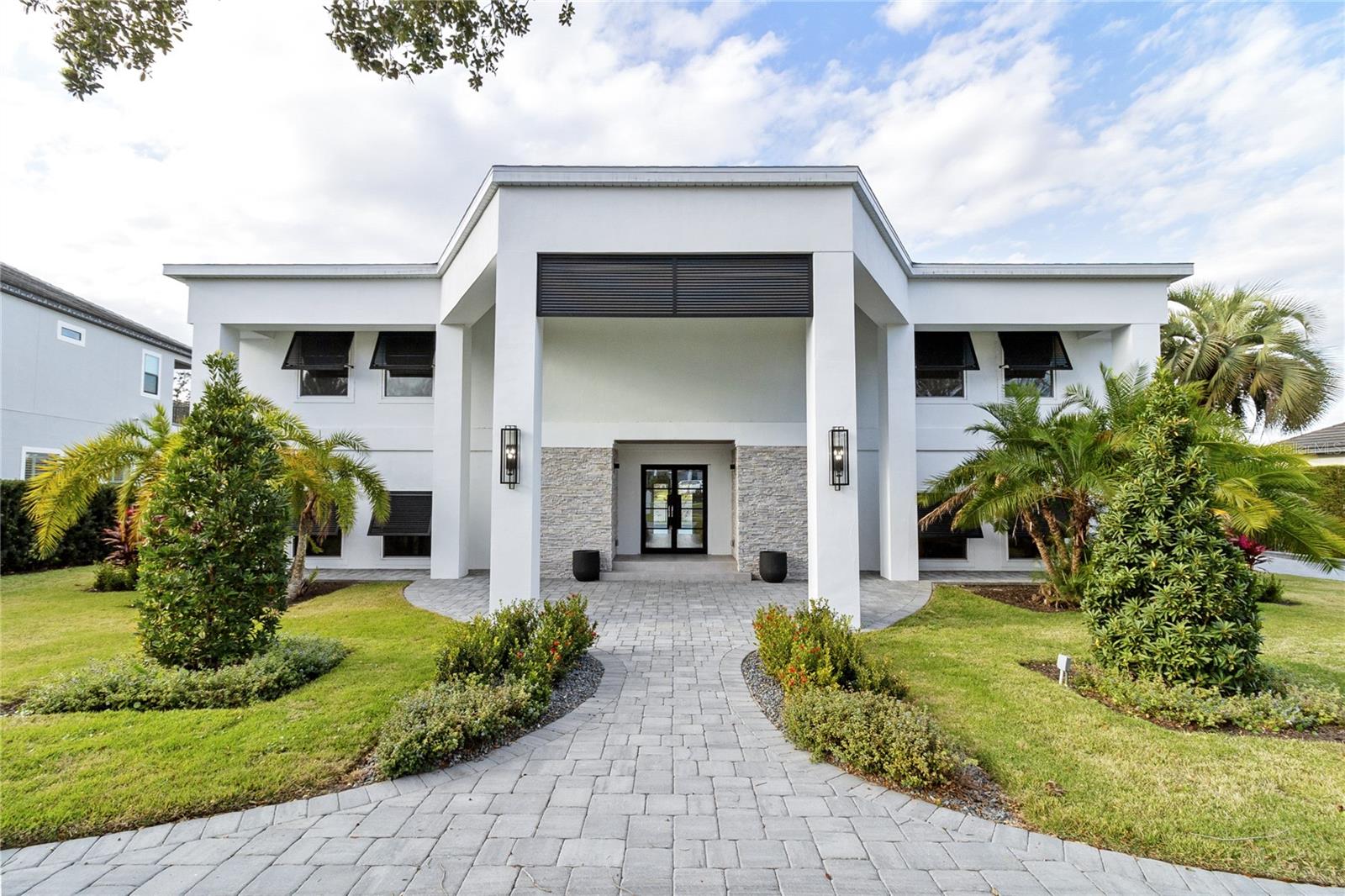 Completely Renovated home set  on 3rd Tee overlooking a lake in Arnold Palmer’s Bay Hill Golf Community. New Roof,  New Windows & doors, New flooring, new appliances and all new cabinetry and design and much much more. This superb home boasts almost 6300 sq ft with roaring 10 ft ceilings throughout the first & second floor. This home offers 5 Bedrooms, 6 bathrooms and  half baths. Upon entering you will find the duel stair case with dome ceiling and a breath taking view of the golf course.  The kitchen features a large island, double refrigerator and contemporary kitchen cabinet design that is a must see.  The open concept kitchen, eating area, dining room and Greatroom over looks the pool, golf course and lake. Also located on first floor  a movie theater with stadium seating and a wet Bar.  Enjoy a private study with built in shelving. The study can be the 6th bedroom and features a walk in closet located on first floor. 
The Primary suite is located on the second floor, with amazing views of golf course with a oversized walk-in closets that features purse and shoe closet, dressing area with mirrors as  well as a separate exercise or message room overlooking golf course. Primary en-suite has a beautifully design with shower and tub enclosed in glass.   The  laundry room is second floor. The upstairs consists of 5 bedrooms - 3 of the bedrooms have  en-suites. a  Enjoy breathtaking views of Championship Golf Course. Welcome Home to 3rd Tee.