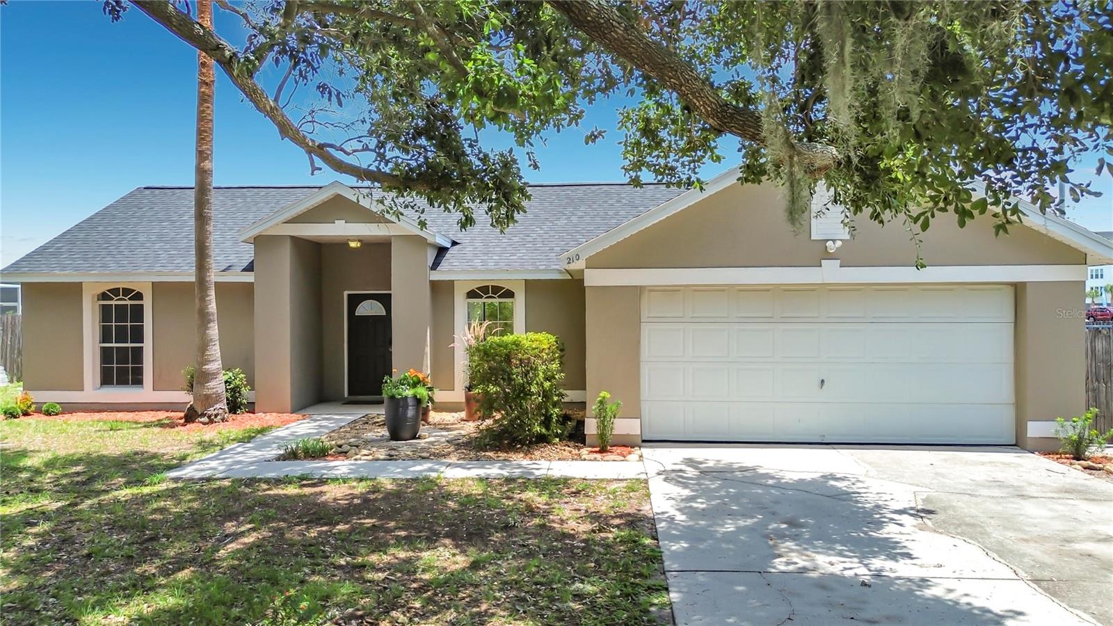 Located in Robbins Rest, this home sits on an oversized lot with water views and a fenced backyard. Outdoor features include a pergola-covered patio, mature grapevines that produce seasonal fruit, and views of the water and surrounding green space. Local birds and wildlife are frequently visible from the backyard, with sunrise and sunset views throughout the year. Recent improvements include a new roof (November 2025), fresh interior and exterior paint, updated lighting and ceiling fans, new blinds.The interior features plank-style flooring in several living areas, tile in the kitchen, and carpet in the primary bedroom. Natural light throughout the home. HOA dues are $35.08 per month. The property is conveniently located near shopping, dining, and major roadways.