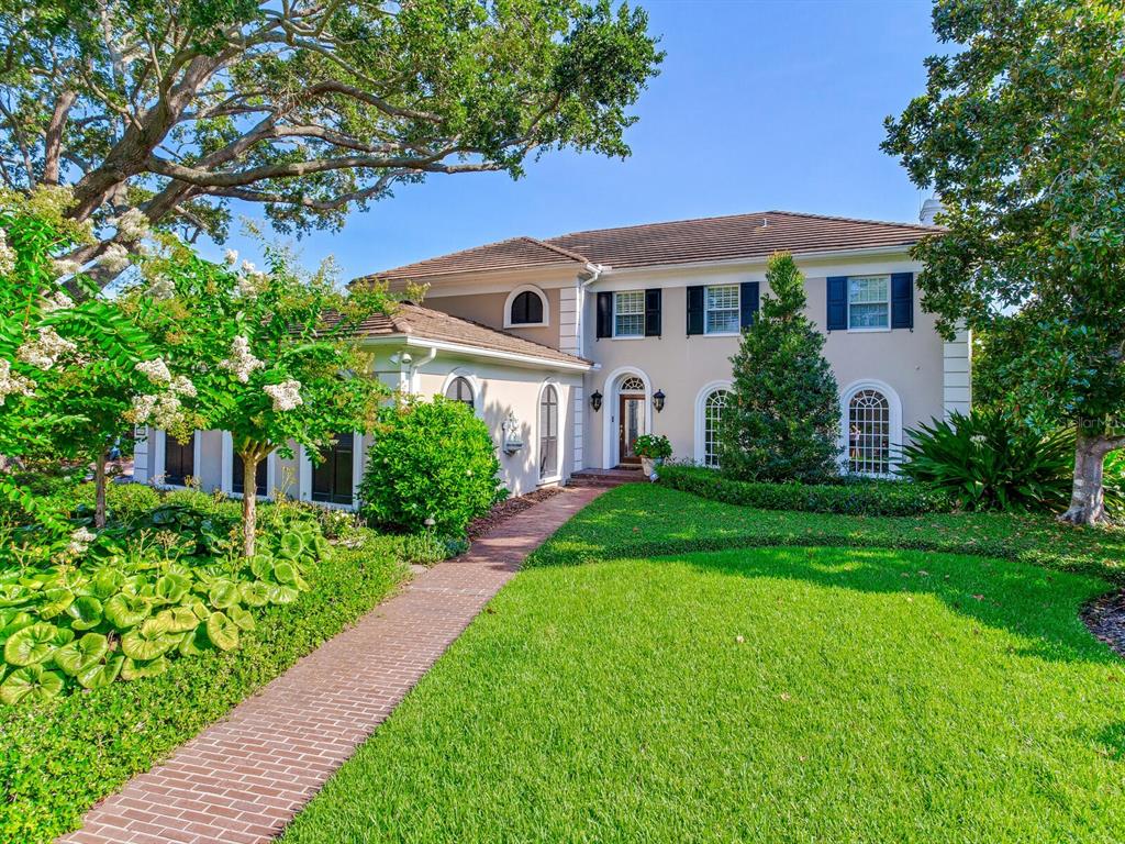 Welcome to Tampa Bay’s TOP gated waterfront neighborhood of Culbreath Isles.
As you wind through the picturesque streets of amazing homes and water views,
you cast off the commotion of the city behind you. You will immediately take notice
of this stunning classic 4 Bed/ 4 Bath Colonial Estate set on a meticulously landscaped 120 x 135
deep water lot with 120 feet of waterfront!!  The over-sized backyard is a boater’s dream complete with a
concrete dock, lift for two boats (25K and 5K lbs), a jet ski, and kayaks. Imagine
walking out your French doors, passing your heated pool with spa oasis and boating
off into the spectacular sunset. Or simply enjoy a quiet morning by the pool with
the Gulf breezes blowing in and admiring the fragrant rose bushes. This Colonial
home features several grand open entertaining spaces with French doors and large
windows throughout, flooding it with natural light. Step into the open foyer and
enter the formal living room with gleaming hardwood floors and crown moldings,
which leads to the large family room with gas fireplace, and the alluring sun-
drenched sunroom. A super bright and airy eat in gourmet kitchen with built-in
stainless appliances overlooks the gorgeous backyard. A formal dining room with
built-in storage, an elegant powder room, and a large laundry room complete the
first floor. Step up to the second floor and enter the sizeable private Owner’s
retreat with ensuite office/sitting room and enjoy the outstanding views of the
waterway below. There is even a second room that is a perfect spot for a personal
yoga retreat, an energizing gym, or private reading room. Separate his and her
walk-in closets, a gorgeous marble bath with a separate shower and a relaxing
soaking tub complete the Owner’s suite. Three oversized additional bedrooms and
two spacious bathrooms perfect this level. Located just an Uber ride to Tampa
International Airport and minutes to Tampa’s top rated public and private schools,
downtown Tampa, luxury shopping, fine dining, and the #1 beaches of America.
Tampa Bay living at its BEST with this spectacular waterfront home in a world class location.