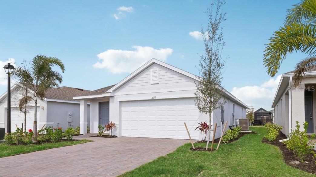 Virtually Staged. Discover your new home in Coral Lakes, Punta Gorda’s vibrant new community by D. R. Horton! Ideally located off Burnt Store Road, this thoughtfully planned neighborhood will feature more than 800 beautiful homes once complete.
The Downing model offers 3 bedrooms, 2 full bathrooms, and 1303 sq. ft. of bright, open living space.  Enjoy quartz countertops, a modern kitchen, and smart home technology designed to make everyday living effortless.
At Coral Lakes, you’ll experience resort-style living with amenities including a sparkling pool, five pickleball courts, a clubhouse, fitness center, event lawn, and a children’s play area – all just steps from your front door.
