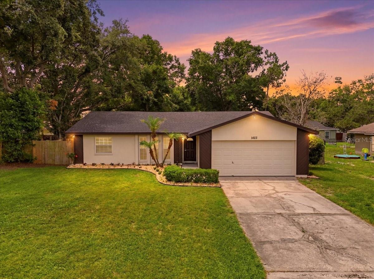 Welcome home to this beautifully updated 3-bedroom, 2-bath residence in desirable South Lakeland! Lovingly remodeled and move-in ready, this home offers a bright, open feel with gleaming wood-look laminate flooring throughout much of the home, abundant natural light, and tasteful designer-neutral colors that create a warm and inviting atmosphere.

The spacious living and dining room combination features large windows that fill the space with sunshine, while the beautifully appointed kitchen offers shaker cabinetry, granite countertops, stainless steel appliances, a breakfast bar, and a convenient closet pantry. French doors from the dining area lead to an expansive enclosed Florida room, providing the perfect setting for relaxing, entertaining, or enjoying year-round Florida living.

The desirable split-bedroom floor plan provides privacy and functionality. The spacious primary suite features a walk-in closet and a private en-suite bath with granite countertops. On the opposite side of the home, you'll find two comfortable guest bedrooms with built-in closets and wood-look laminate flooring, along with a well-appointed hall bath featuring tile flooring and a vanity with ample storage.

Recent updates include a new roof (2022), new HVAC system (2024), updated lighting, fresh interior paint, and newer windows, offering both style and peace of mind.

Step outside to enjoy the large fenced backyard and open patio, perfect for gatherings, pets, gardening, or simply enjoying the outdoors. The oversized enclosed Florida room is flooded with natural light and provides flexible living space for a family room, game room, home office, or entertaining area.

Additional features include a two-car garage and a fantastic location directly across from the community playground and basketball courts. With its thoughtful updates, inviting living spaces, and prime South Lakeland location, this home is ready to welcome its next owners. Don't miss this opportunity!