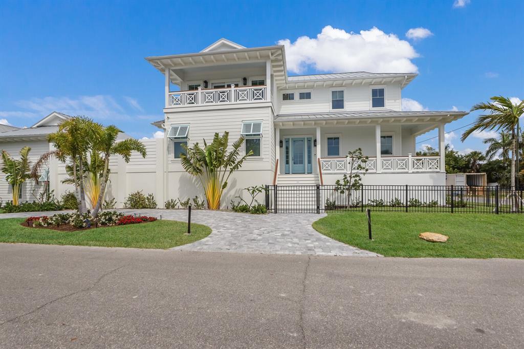 ONE OF ONLY TWO NEW CONSTRUCTION HOMES AVAILABLE IN BOCA GRANDE! Located on Boca Grande’s most Iconic Historic Street! A BANYAN NEW BUILD BEAUTY… The architecture features a true Coastal Contemporary Design. Three spacious en-suites plus a 4th Powder Room. Located in the heart of BG Village, you are just a few hundred feet to the beach and all the town has to offer. The outside living area boasts an elevated private courtyard pool with waterfall, along with a covered lanai. Featuring expansive impact sliders, that bring the inside and outside space directly into one. Interior features include; solid core interior doors, quartz stone surface countertops, white oak, wide plank, engineered wood flooring, numerous custom details and hand selected fixtures and finish’s. Extensive stunning custom mill work throughout including multi level ceiling trim details, quarter gap ship lap accent walls and tongue & groove ceilings, wood cabinets, all zero entry showers and Thermidor appliances. The first living level Master Suite offers a dramatic arrangement with custom wood trim / cabinetry, walk-in closet systems, and a luxurious bathroom with free standing tub and wide walk-in frameless shower enclosure. The 2 additional en-suite guest bedrooms will provide convenient access to the Media / Viewing (2nd Living Room) on the top level, in addition to the Elevator servicing all floors. A fortified construction process with Win-Guard impact gliding doors, Weather Shield impact windows, and hurricane rated exterior doors - including the expansive 3 car + garage level. THIS BEAUTIFUL NEW HOME IS READY TO MOVE INTO AND THE SURROUNDING NEW BUILDS AND REMODELS ARE ALSO NOW COMPLETE! THIS IS IN THE HEART OF THE VILLAGE - SPECTACULAR - COME TO TAKE A LOOK.