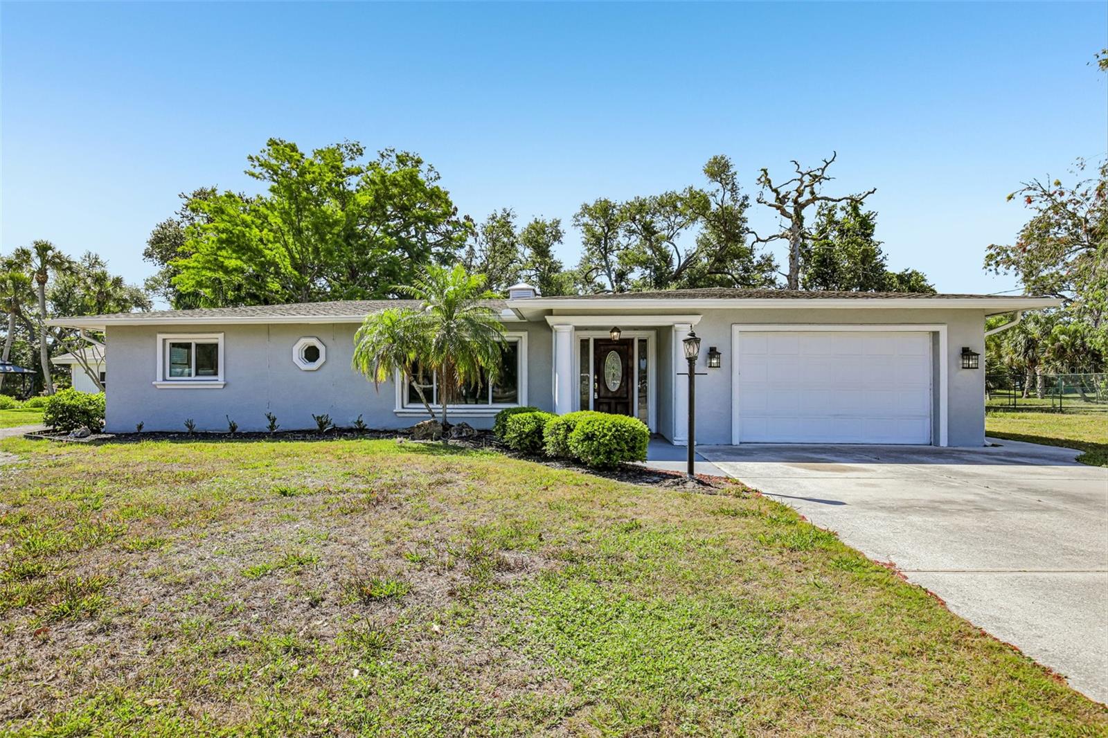Virtually Staged. If you’ve been looking for a chance to create your own custom coastal escape, this Nokomis property West of the Trail is ready for its next chapter. Located just a mile from the sands of Casey Key and two miles from the North Jetty, the location is unbeatable. While several major systems have been updated—including the A/C (2022), re-pipe (2021), and impact windows (2020)—the interior is ready for your personality.
The "bones" of this solid block home offer a flexible layout, featuring a Primary Suite with mudroom access and a bonus room with a third bath that is prime for a conversion into a home office or guest suite. Outside, the oversized third-of-an-acre lot provides a massive canvas for those dreaming of a pool or needing space for a boat and RV, though the landscaping and screened lanai are currently awaiting a refresh. This is a fantastic opportunity for a buyer who wants to bypass the "big ticket" maintenance items and focus their energy on the incredible coastal lifestyle.