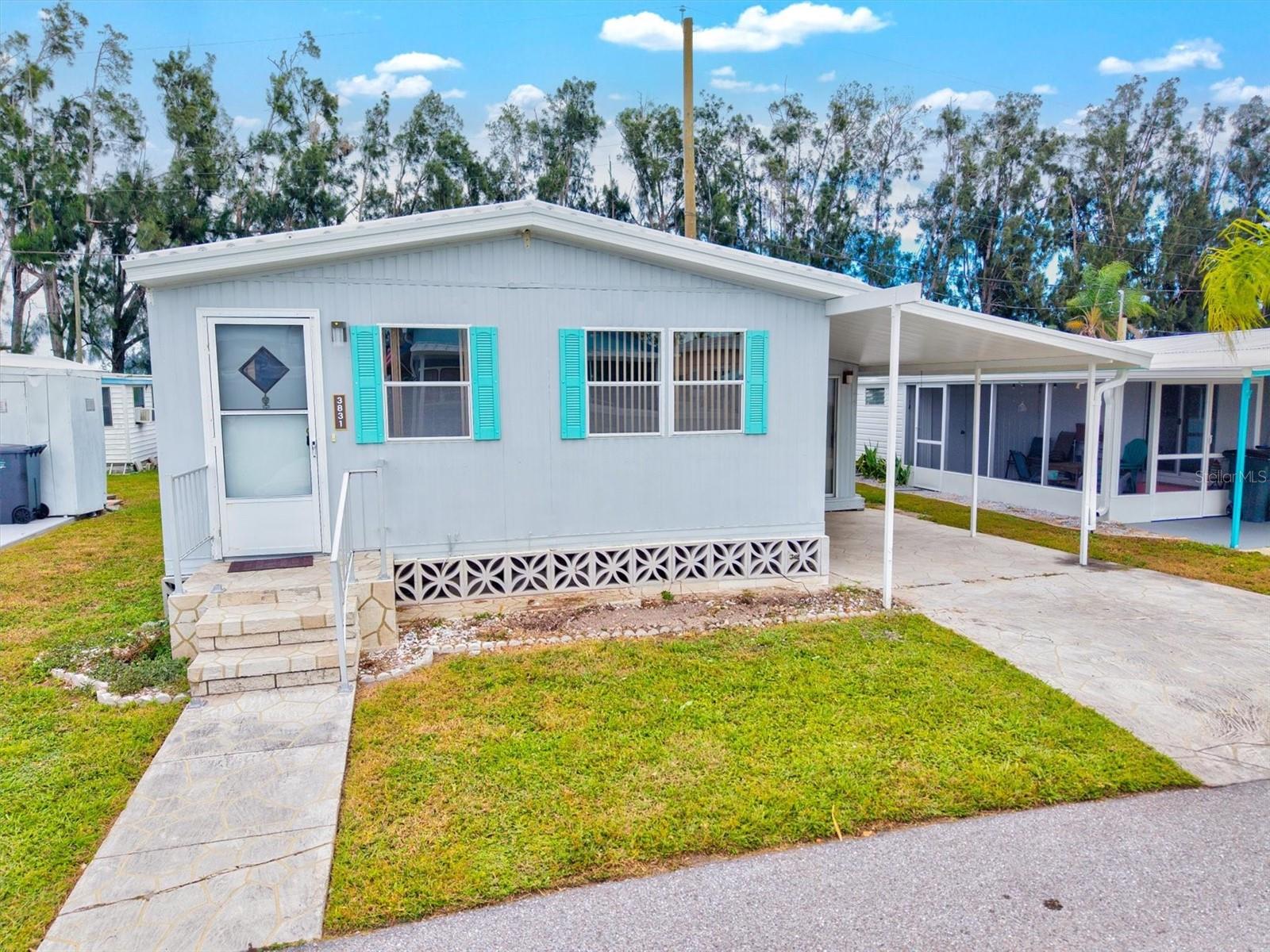 RARE DOUBLE LOT OPPORTUNITY! This adorable and charming home, situated on a rare front-to-back double lot, offers the perfect combination of comfort, flexibility, and fun! Located in the welcoming community of Sunny Shores, this property stands out for its affordability and freedom — with no HOA, no lot rent, no age restrictions, no rental restrictions and no deed restrictions. The home has been completely remodeled and is ready for immediate move-in, featuring 2 bedrooms and 2 bath, plus an additional bonus space that could easily serve as a third bedroom, office, or flex room. Bright, inviting interiors create a cozy atmosphere you’ll love coming home to. Outside, the second lot offers even more possibilities — it includes a spacious workshop/storage building and an oversized carport, perfect for your cars, boats, or recreational toys. You could even subdivide and sell the extra lot for added value! Whether you’re seeking a year-round residence, a seasonal getaway, or a savvy investment property, this home fits the bill. With no rental restrictions, nightly rentals are allowed, giving you full flexibility for income potential. Sunny shores stands out as it offers everyone affordability with no HOA, deed restrictions, or rental restrictions! Bring your furry friends without hesitation. Located just minutes from beautiful Gulf beaches, shopping, and dining, this home offers the best of Florida living — relaxed, affordable, and full of possibilities.