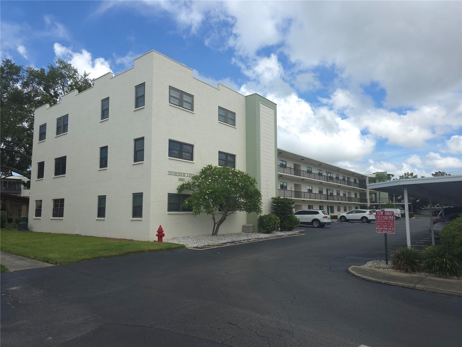 PRICED BELOW MARKET VALUE FOR A QUICK SALE! CASH BUYERS ONLY! Welcome to the highly desirable 55+ Terrace Park at Five Towns community, where comfort, convenience, and an active Florida lifestyle come together. This move-in-ready second-floor condominium offers 2 bedrooms, 2 full bathrooms, serene pond and pool views, a private screened balcony with hurricane protection, and the convenience of an in-unit washer and dryer.

Step inside and discover a bright and inviting floor plan featuring attractive luxury vinyl flooring that adds both style and durability throughout the living spaces. The spacious kitchen offers room for a breakfast nook, while the expansive living area provides flexibility for both dining and a home office workspace. Numerous updates have already been completed, including updated light fixtures, a replaced master bath vanity, and updated bi-fold doors, creating a fresh and modern feel throughout.

The primary suite features a walk-in shower for added comfort and accessibility. Outside, relax on your screened balcony overlooking the peaceful pond and sparkling pool, the perfect setting for morning coffee or evening sunsets.

Your assigned covered carport keeps your vehicle cool and protected year-round. Just steps away is one of the community's many pools, while the newly completed outdoor kitchen area at the Magnolia Sun Clubhouse provides the perfect place to gather with friends and neighbors.

Five Towns is renowned for its exceptional amenities and vibrant social atmosphere, offering multiple heated pools, two clubhouses, tennis courts, pickleball, bocce ball, shuffleboard, fitness and exercise classes, and a full calendar of social events detailed in the community newsletter.

The monthly condominium fee provides outstanding value and includes water, sewer, trash, gas, cable television, internet service, and access to all community amenities.

Ideally located near the Gulf beaches, shopping, dining, entertainment, Interstate 275, and vibrant downtown St. Petersburg, this home offers easy access to everything the Florida Gulf Coast has to offer this condo is a exceptional value, beautiful pond and pool views, luxury vinyl flooring, numerous updates, covered parking, and resort-style amenities, this is an outstanding opportunity to enjoy the very best of Florida living. Schedule your private showing today before this exceptional value is gone!
