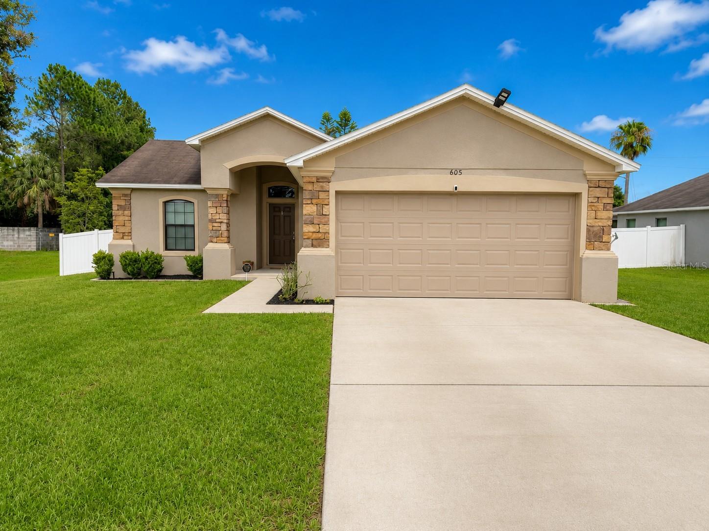 One or more photo(s) has been virtually staged. Rare privacy! No neighbor to the left, fenced backyard, retention pond views, and move-in ready condition.

Welcome to 605 Valencia Ct in Dundee, where comfort, privacy, and convenience come together. This beautifully maintained, move-in ready home features stylish gray wood-look flooring throughout, creating a modern and cohesive feel from room to room.

Step outside to enjoy the fully fenced backyard, perfect for pets, family gatherings, and outdoor entertaining. One of the home's most desirable features is its unique setting with no neighboring home on the left side, offering additional privacy and open views of the adjacent retention pond and green space. The extra room to play and enjoy the outdoors makes this lot stand out from the rest. A water softener system is also included, adding everyday convenience and helping protect appliances and plumbing fixtures.

The home's attractive landscaping provides excellent curb appeal and a welcoming first impression. Conveniently located near shopping, dining, parks, schools, and major roadways, this property is situated in one of Central Florida's growing areas, offering easy access to expanding employment centers and everyday conveniences.

Whether you're a first-time homebuyer, looking to downsize, or seeking a great investment opportunity, this home offers the perfect combination of privacy, functionality, and move-in ready appeal.