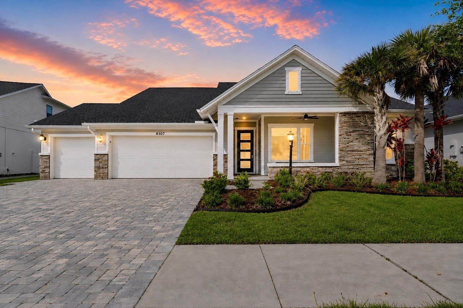 Welcome to Copeland Creek - Where Luxury Meets Smart Living. Tucked within the prestigious gated community of Copeland Creek in Odessa, this stunning 2023-built David Weekley home delivers an exceptional living experience that's nearly impossible to replicate. This exquisite 6 bedroom, 4.5 bath residence with a loft/den, and 4-car garage sits in one of Tampa Bay's most sought-after school districts, and it shows in every thoughtfully curated detail. A warm and welcoming foyer with a soaring tray ceiling and elegant light fixture sets the tone for the refined craftsmanship found throughout. The open-concept layout flows effortlessly from room to room, creating an unmistakably elevated tone. The great room centers around a custom built-in entertainment wall with a contemporary fireplace and upgraded speaker system, equally suited for quiet evenings in or lively gatherings with friends. The gourmet kitchen is a showstopper featuring a massive center island, two-tone white and taupe cabinetry, a large walk-in pantry, stainless appliances, dry bar, and brushed gold finishes throughout. The thoughtfully designed split floorplan offers true flexibility. The primary suite is privately nestled in the rear wing of the main floor, offering both convenience and seclusion, with 3 large windows flooding the space with natural light and peaceful backyard views. The spa-inspired en-suite features an oversized walk-in shower, extended dual-sink vanity with brushed gold fixtures, and 2 generously sized walk-in closets. A 2nd main-floor bedroom enjoys its own dedicated en-suite, while 2 additional bedrooms and a full bath are in the front wing of the house. Upstairs, a spacious loft-style retreat serves as a secondary living area perfect for movie nights or a playroom, with a generously sized bedroom and full bath rounding out the upper floor. The front flex room framed by elegant glass French doors, offers versatility as a 6th bedroom, home office, or dual-purpose workspace, and features a custom built-in Queen Murphy bed that tucks away when not in use. Step outside and discover one of the largest fully fenced in backyards in the community, along with a covered outdoor kitchen that’s fully equipped with a built-in grill, smoker, cooktop, icemaker, mounted TV, and plenty of outdoor seating, surrounded by refined hardscaping and an outdoor shower, with full electric and plumbing for a future pool. The 4-car garage features epoxy flooring, Tesla charging station, Culligan whole-home water softener, and ample storage space. The state-of-the-art Enphase Solar + Battery Backup System, including multiple battery units, dedicated backup panel, and full home integration, offers true energy independence, reducing or eliminating electric bills and keeping the home powered through any storm. In today's Tampa Bay market, this is one of the most valuable and forward-thinking upgrades available. Additional upgrades include a hardwired electrical circuit for security and monitoring system, electric blinds, updated ceiling fans, and two zoned high-efficiency HVAC systems for year-round comfort on both floors. Every upgrade professionally permitted and completed to the highest standard. With low HOA fees, a prestigious gated entry, top-rated schools, and convenient access to shopping, dining, recreation, and major highways, this isn't just a home, it's a lifestyle investment, designed for those who expect the very best. Assumable financing available at 6.25%.