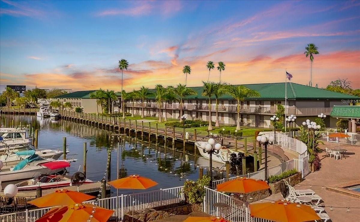 PRICE REDUCED! Say hello to your Florida escape at Sarasota Cay Club—where flip flops, sunshine, and RENTAL INCOME all go hand in hand! NO LEASE OR SHORT TERM RENTAL RESTRICTIONS! This 1 bedroom, 1 bath 2nd FLOOR condo-hotel unit has NO STORM DAMAGE and comes TURNKEY FURNISHED with 2 comfy beds, updated finishes, a BRAND NEW AC UNIT and all the essentials for you (or your guests) to dive straight into vacation mode. With NO MINIMUM RENTAL RESTRICTIONS, you can enjoy the unit whenever you like and rent it out the rest of the year for effortless income through AIRBNB, VRBO, or the onsite program. The highlight? These buildings surround a FULL-SERVICE MARINA with DIRECT GULF ACCESS. Step out your door and onto the dock and onto your boat, into a kayak, hop aboard a fishing charter, or simply sip something tropical at the Tiki Bar & Restaurant while watching the sunset over the water. You and guests will have full access to the facilities at the adjacent property, The Ramada by Wyndham Sarasota Waterfront Resort where you’ll enjoy AMENITIES GALORE: heated waterfront pool, Tiki Bar & Grill and Restaurant, volleyball courts, fitness center, breakfast buffet, arcade, kayak rentals, boat rentals and plenty of space to soak in that laid-back, toes-in-the-sand lifestyle. Onsite staff is available for housekeeping, laundry, and supply restocking, so turnover between guests is a breeze. Monthly HOA fees cover ALL UTILITIES—Electric, Water, Cable, Sewer, Trash, Pest, Guest internet service, Control and Insurance—keeping your costs simple and predictable.
Just minutes from Sarasota Airport, downtown Sarasota, and world-famous beaches, this is more than a condo—it’s your ticket to fun, sun, and profit on Florida’s Gulf Coast.
 Prime location: minutes to SRQ Airport, downtown Sarasota, St. Armands Circle, IMG Academy, Anna Maria and Siesta Key Islands. Whether you’re seeking a turnkey vacation base, an income producer, or both, this unit delivers coastal convenience and revenue flexibility in one of Sarasota’s most accessible waterfront settings.